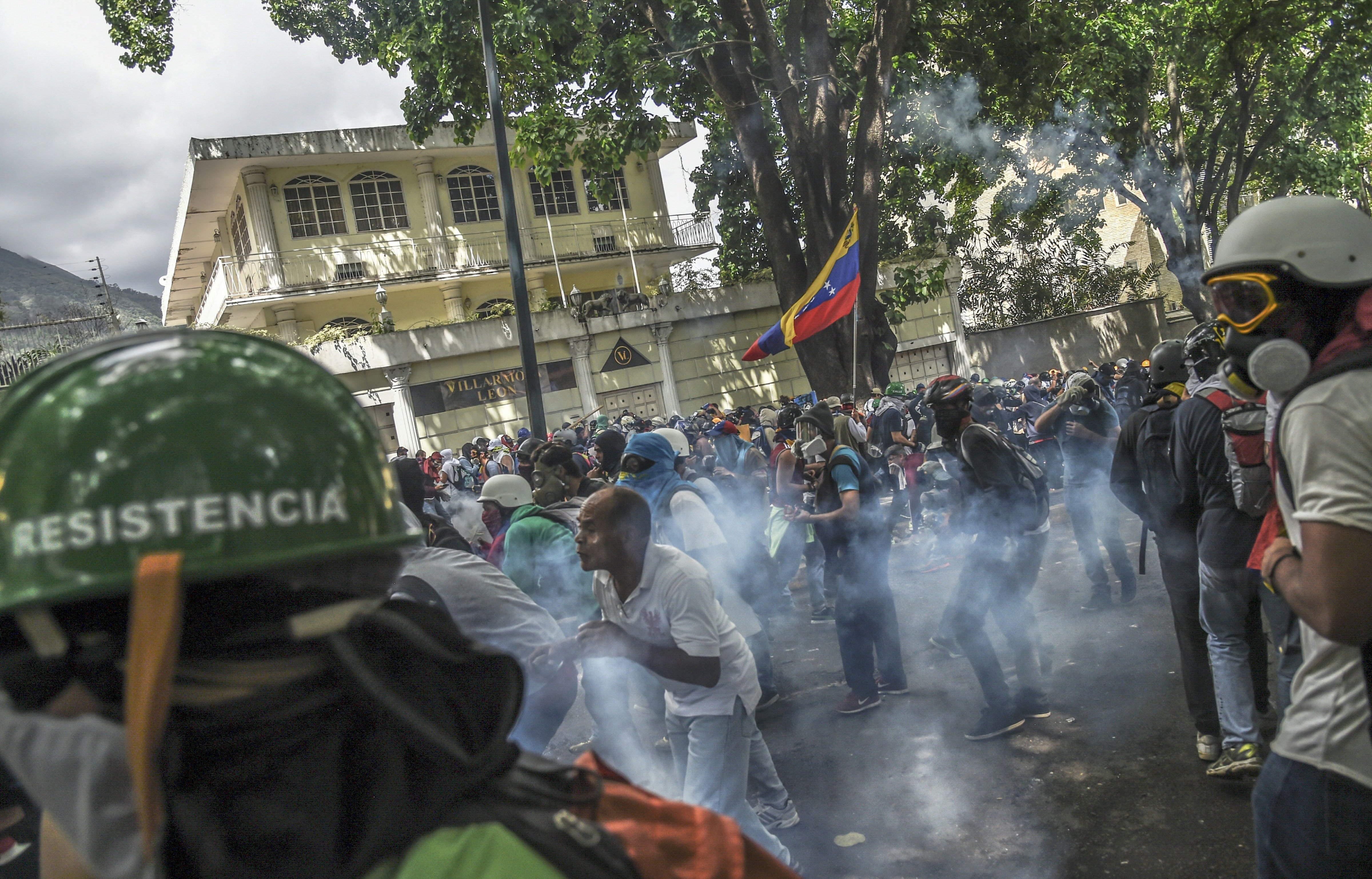 Opposition activists clash with riot police during a march against Venezuelan President Nicolas Maduro held on May Day in Caracas, May 1, 2017. (Juan Barreto—AFP/Getty Images)