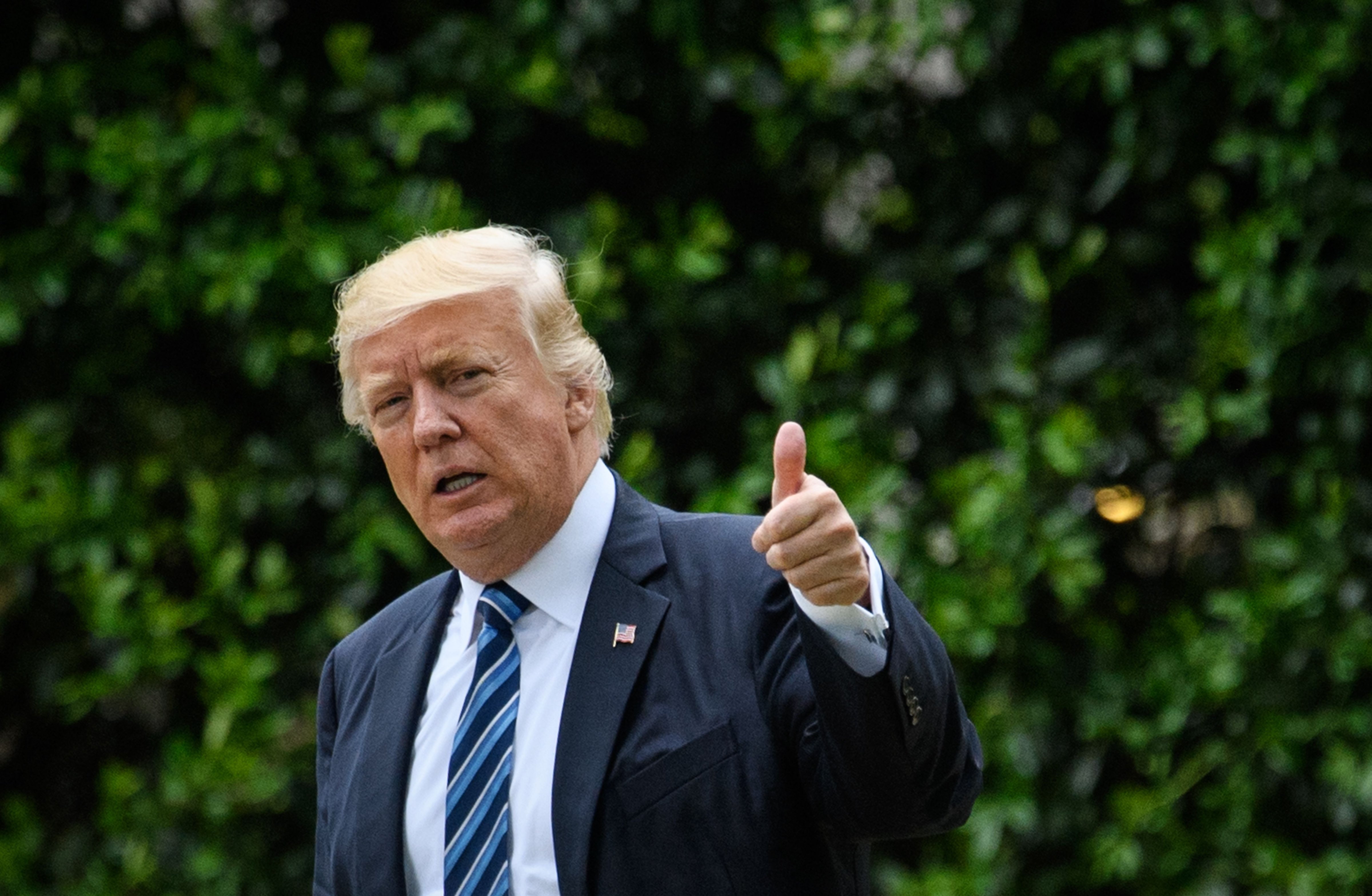 US President Donald Trump gives the thumbs-up as he makes his way to board Marine One on the South Lawn of the White House in Washington, DC on May 4, 2017. Trump was headed to New York, NY. (MANDEL NGAN—AFP/Getty Images)