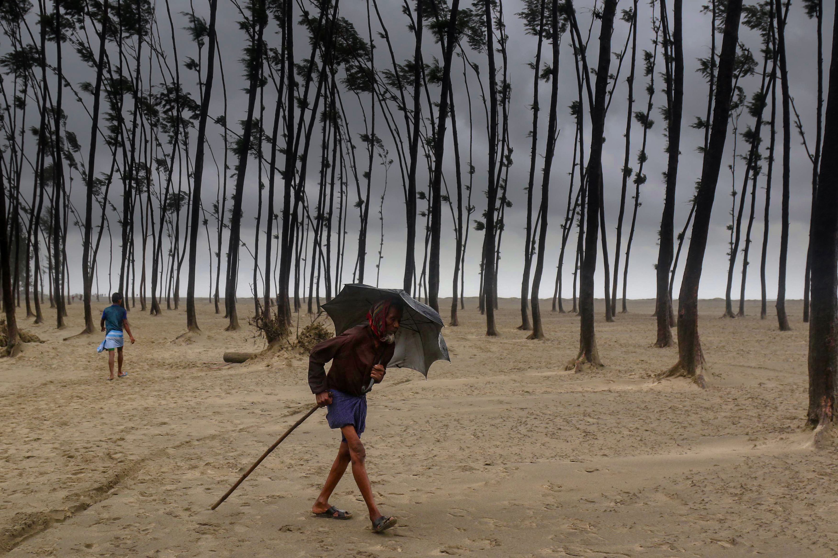 A Bangladeshi villager evacuates to a cyclone shelter on the coast in Cox's Bazar district on May 30, 2017. (AFP/Getty Images)