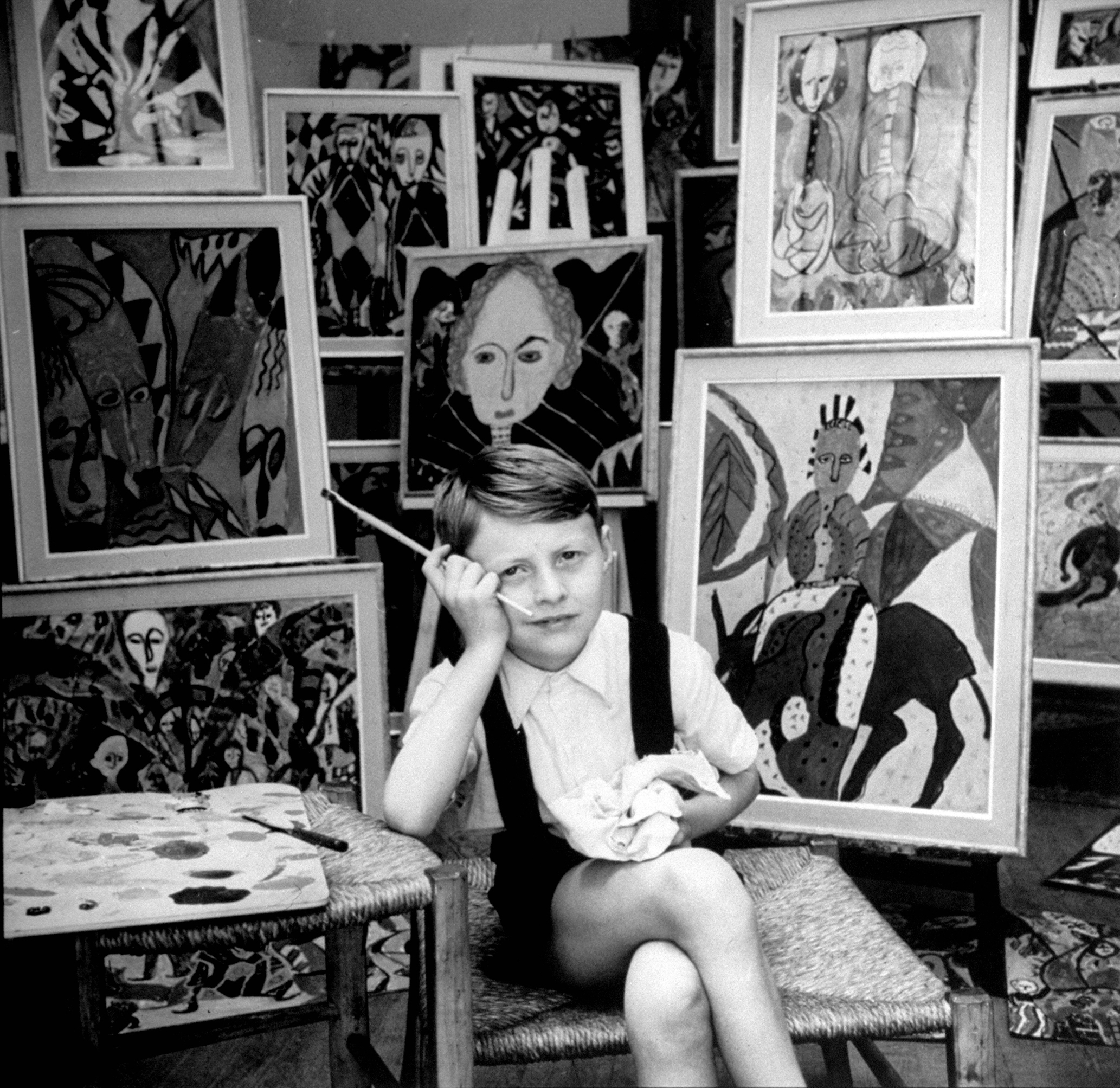 Nine year old prodigy, Hansan Kaptan, Turkish child, has an exhibition at a gallery in Paris, France, 1951.