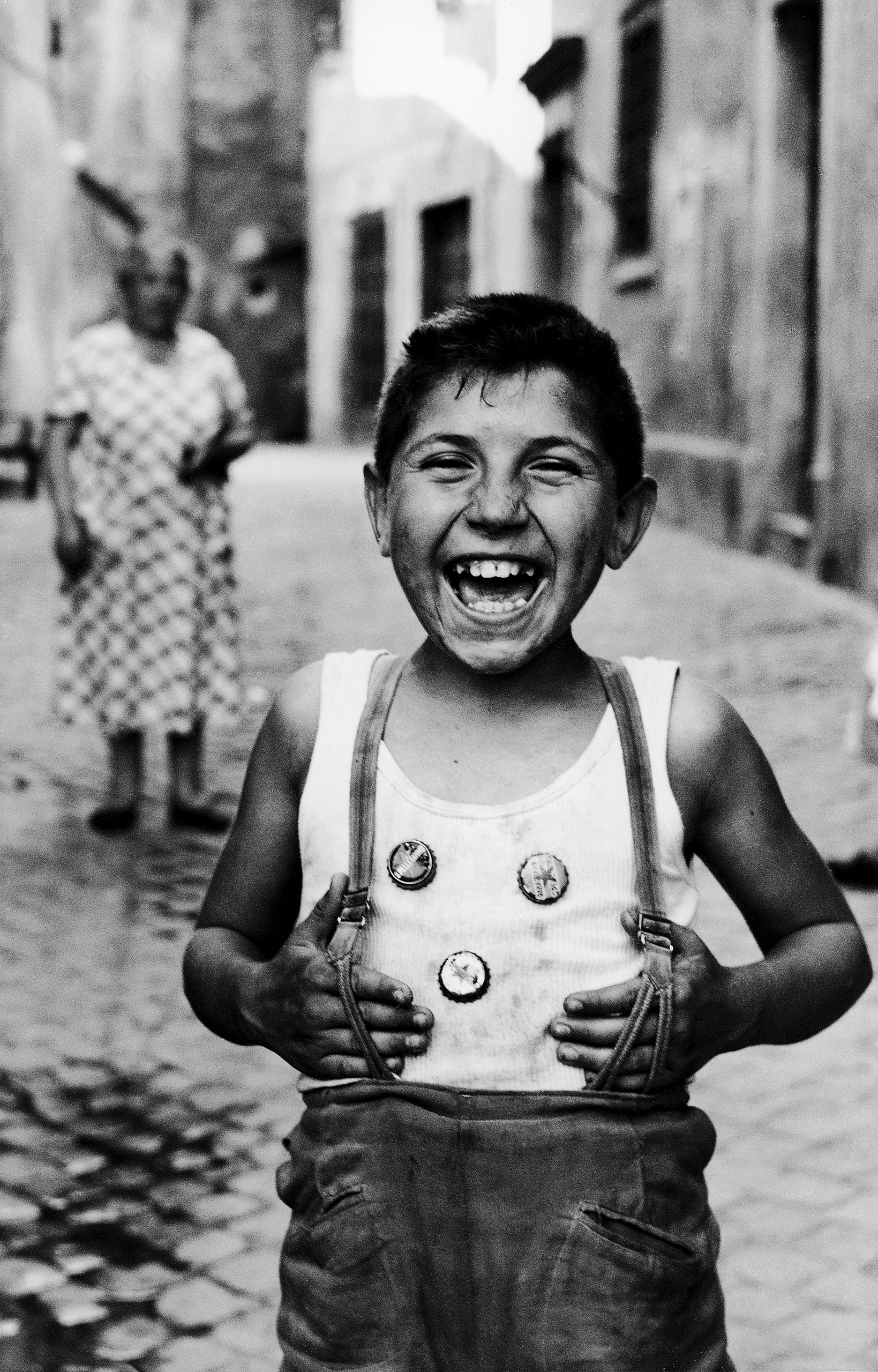 Laughing boy on street in Trastevere, Rome, 1958.