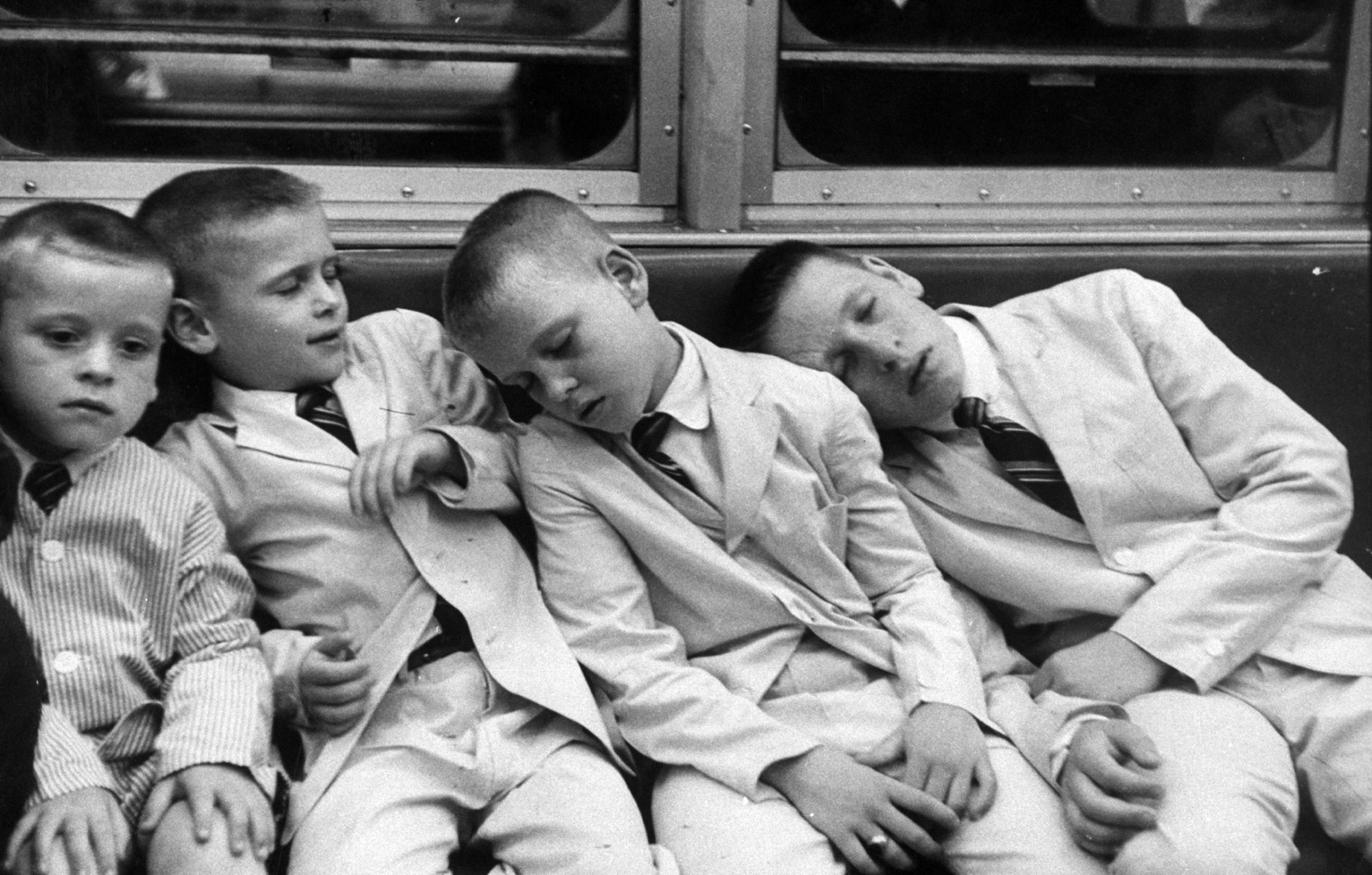 Little boys sleeping on a subway car in New York, NY, 1959.