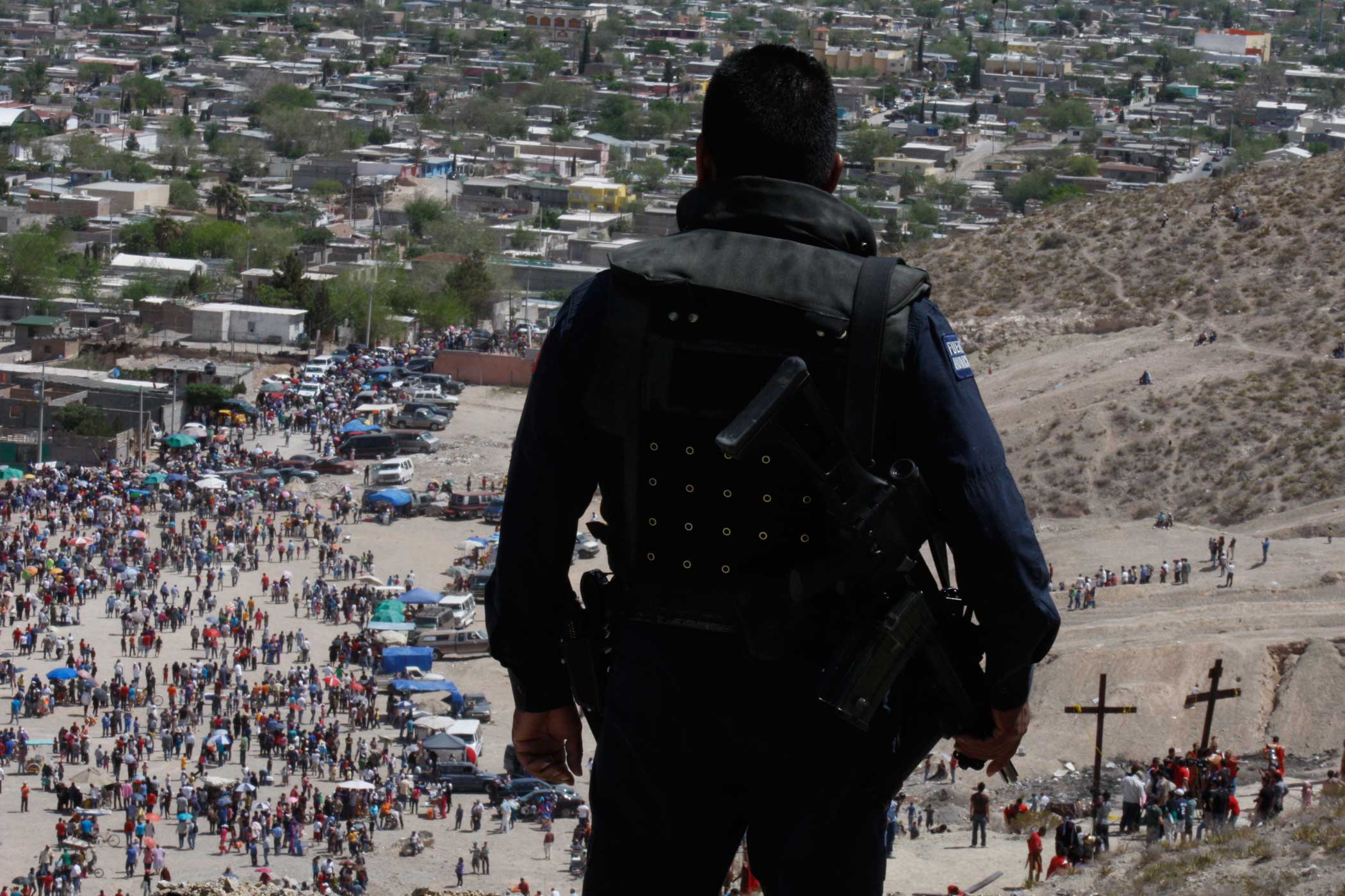 Secuirty personell oversees Good Friday celebrations in Juarez in April, 2012.