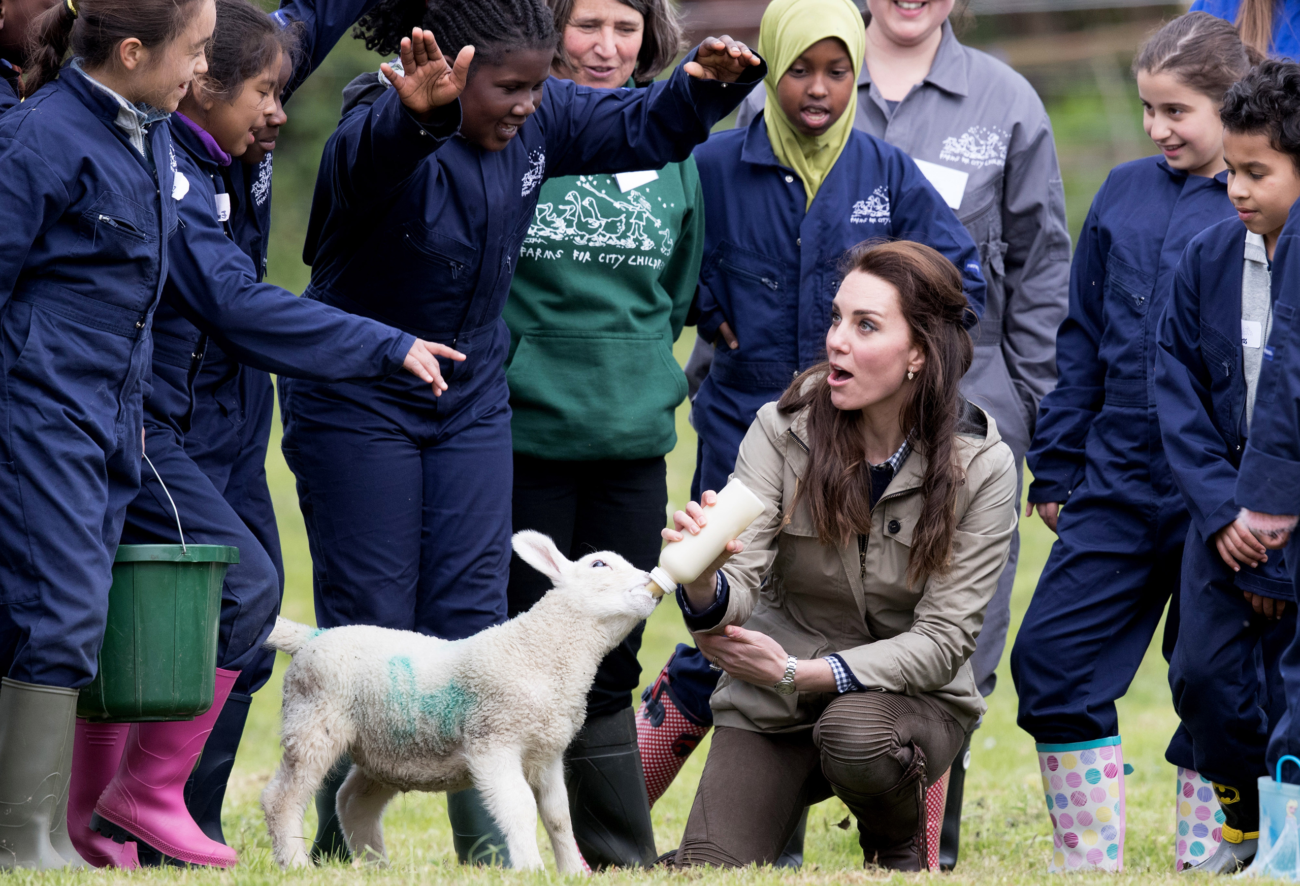 Catherine, Duchess of Cambridge feeds "Stinky" the lamb during a visit to Author Michael Morpurgo's Farms for City Children in Arlingham, Gloucestershire, on May 3, 2017. (Matt Cardy—Getty Images)