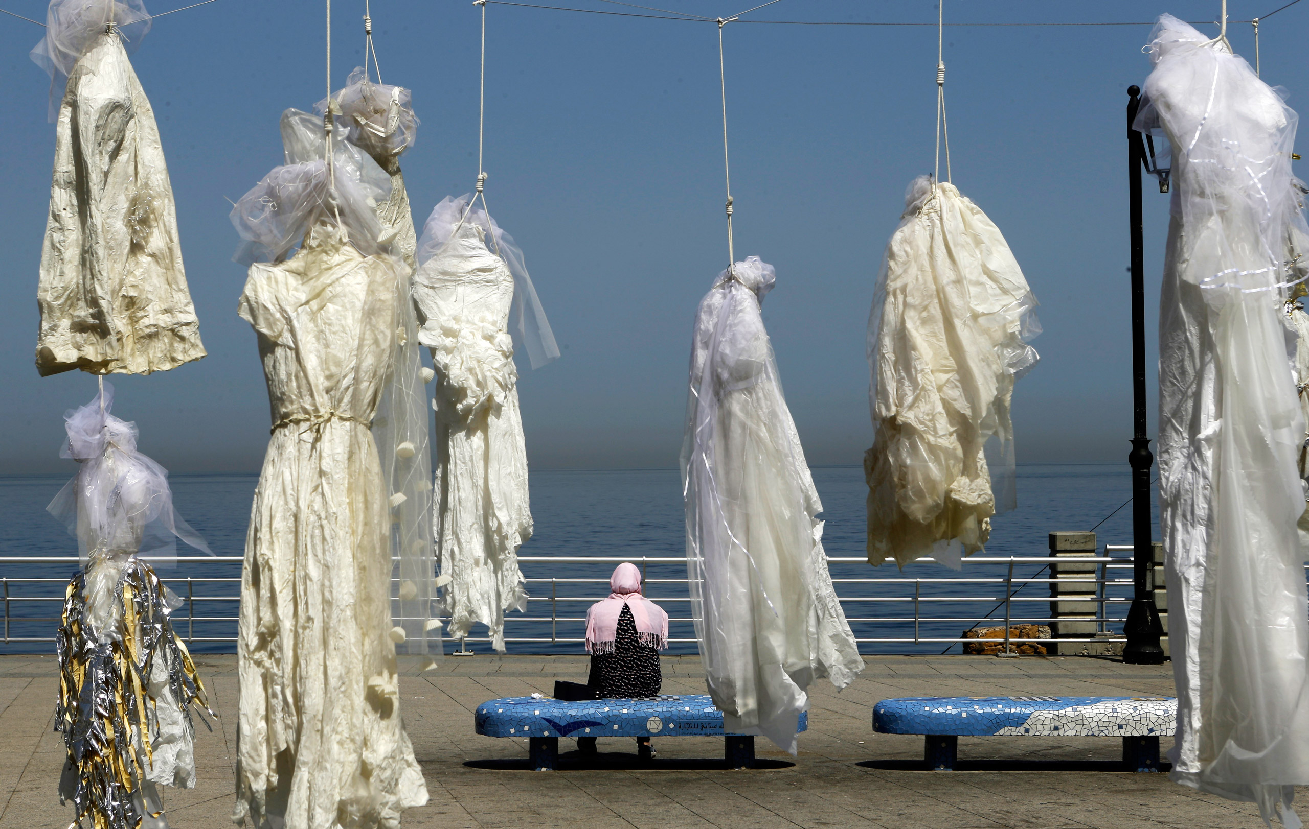 Artist Mirelle Honein and non-profit Abaad campaigned against Lebanon’s law on rape by hanging wedding dresses on nooses in Beirut (Patrick Baz&mdash;AFP/Getty Images)