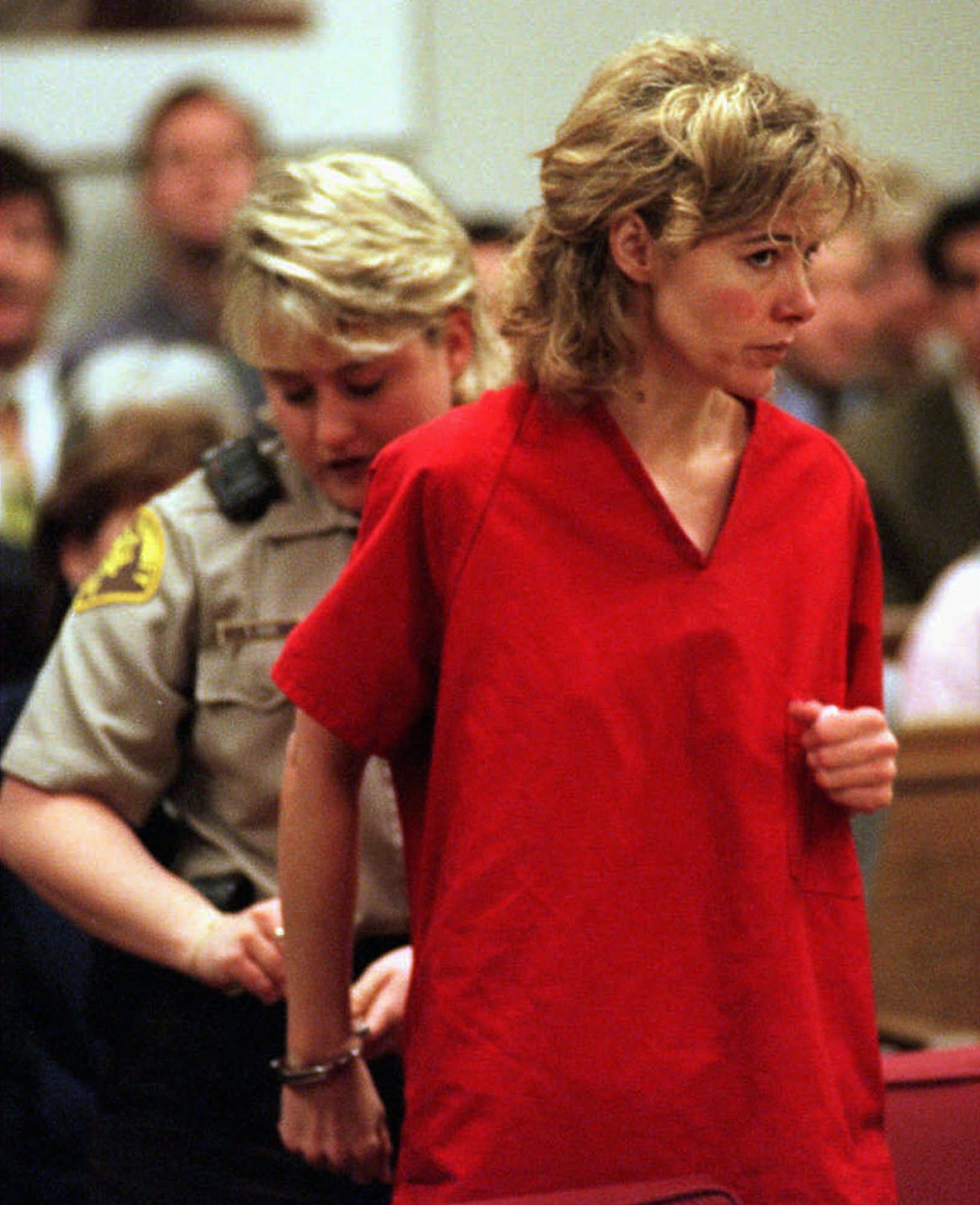 Mary Kay LeTourneau has her handcuffs removed at the start of a hearing in Seattle, on Feb. 6, 1998. (Alan Berner—AP)