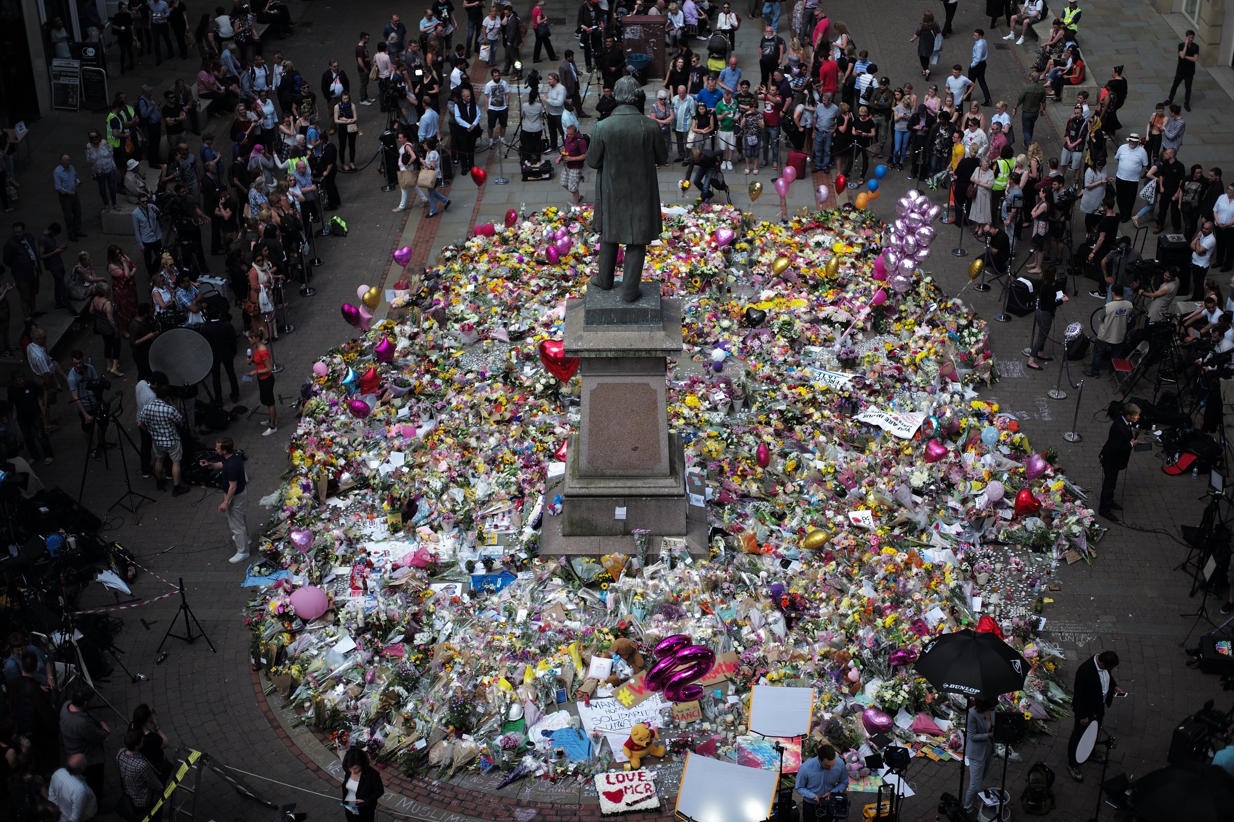 The carpet of floral tributes to the victims and injured of the Manchester Arena bombing covers the ground in St Ann's Square on May 25, 2017 in Manchester, England.