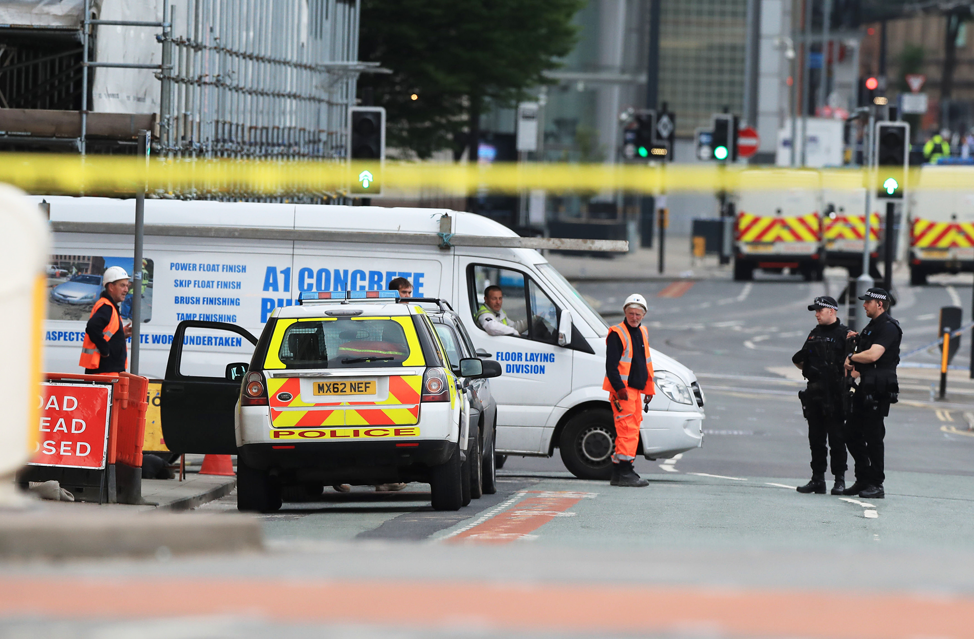 Police near the Manchester Arena the morning after an attack at the end of a concert by Ariana Grande left 22 dead, on May 23, 2017. (Peter Byrne—PA Wire/AP)