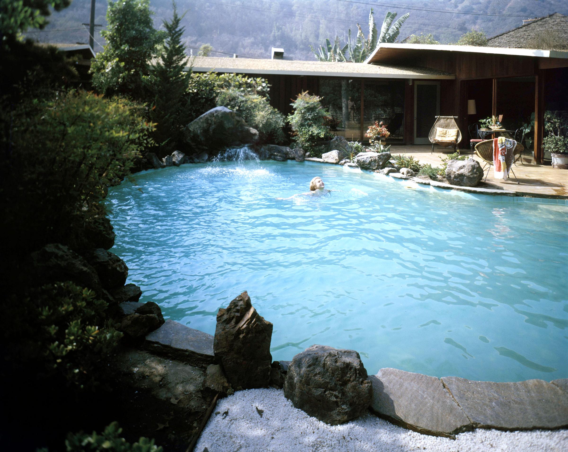 Color photographs of backyard pools in 1960.