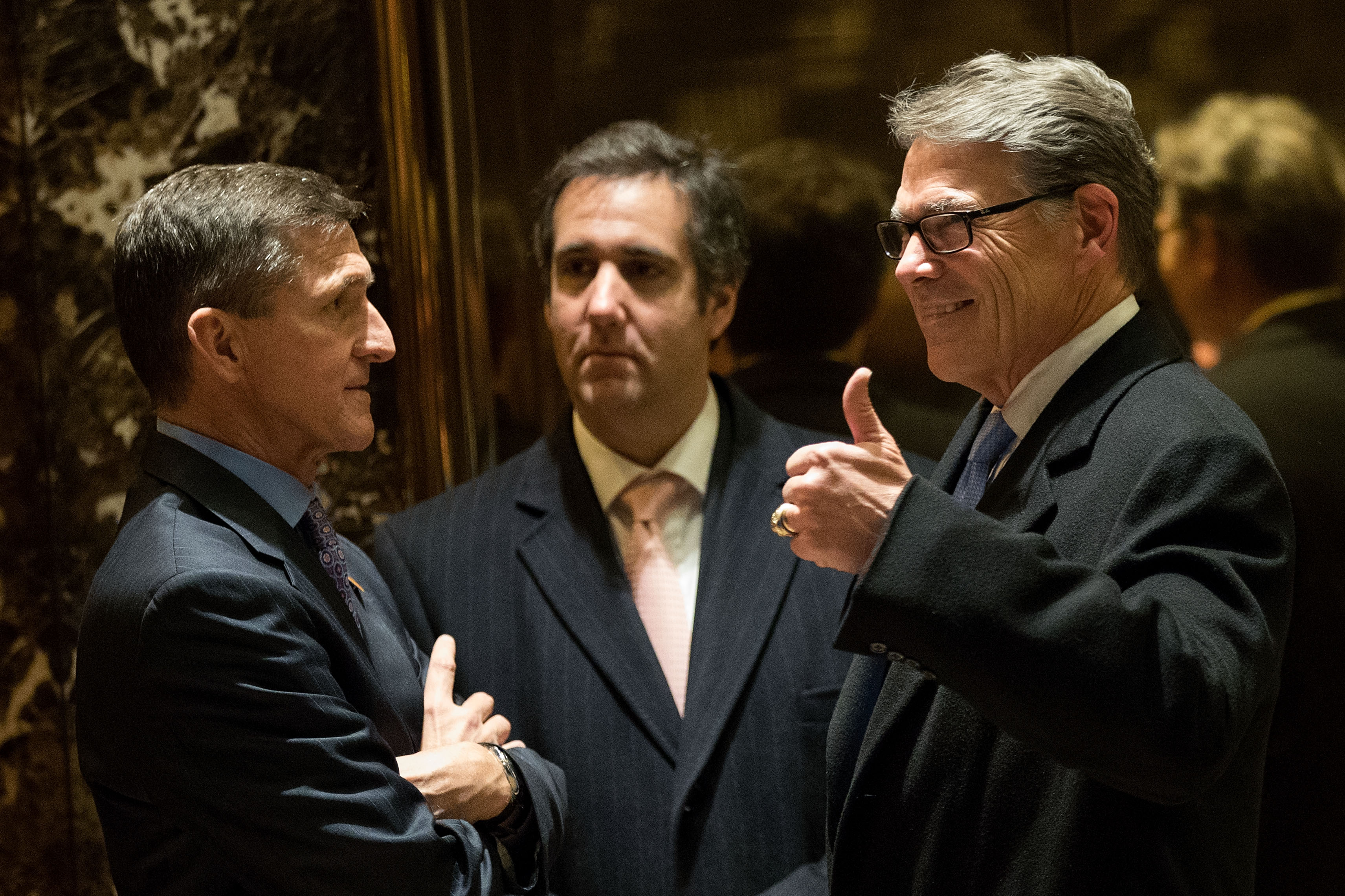 Retired Lt. Gen. Michael Flynn, Michael Cohen, executive vice president of the Trump Organization and special counsel to Donald Trump, and former Texas Governor Rick Perry at Trump Tower, Dec. 12, 2016 in New York City. (Drew Angerer—Getty Images)