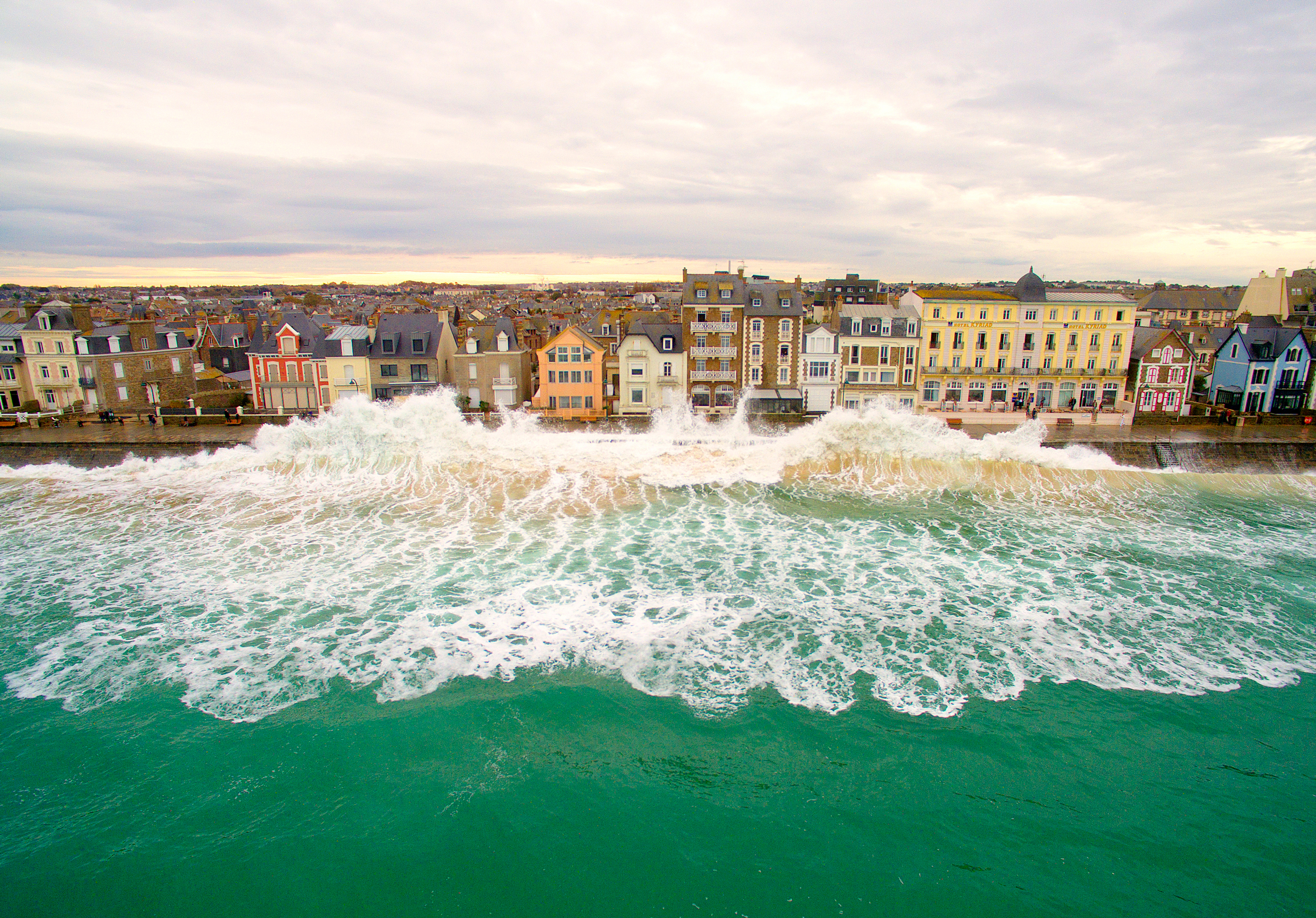 Waves crash into a barrier in Saint-Malo, France. Taken from 53 feet.