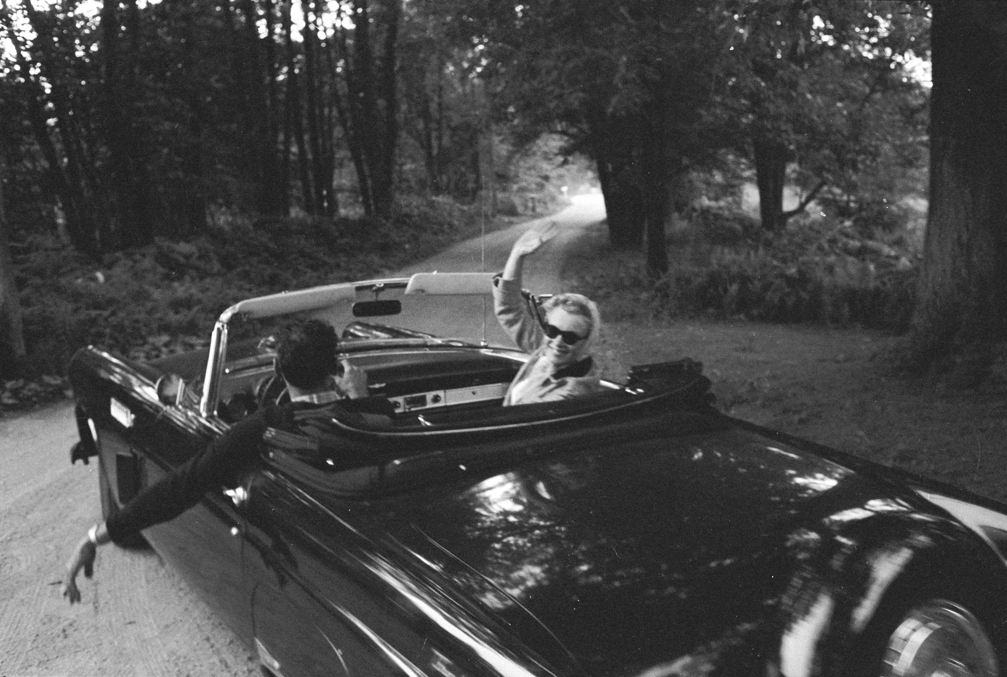 Marilyn Monroe and her husband Arthur Miller drive to Connecticut in 1956, shortly after their marriage.