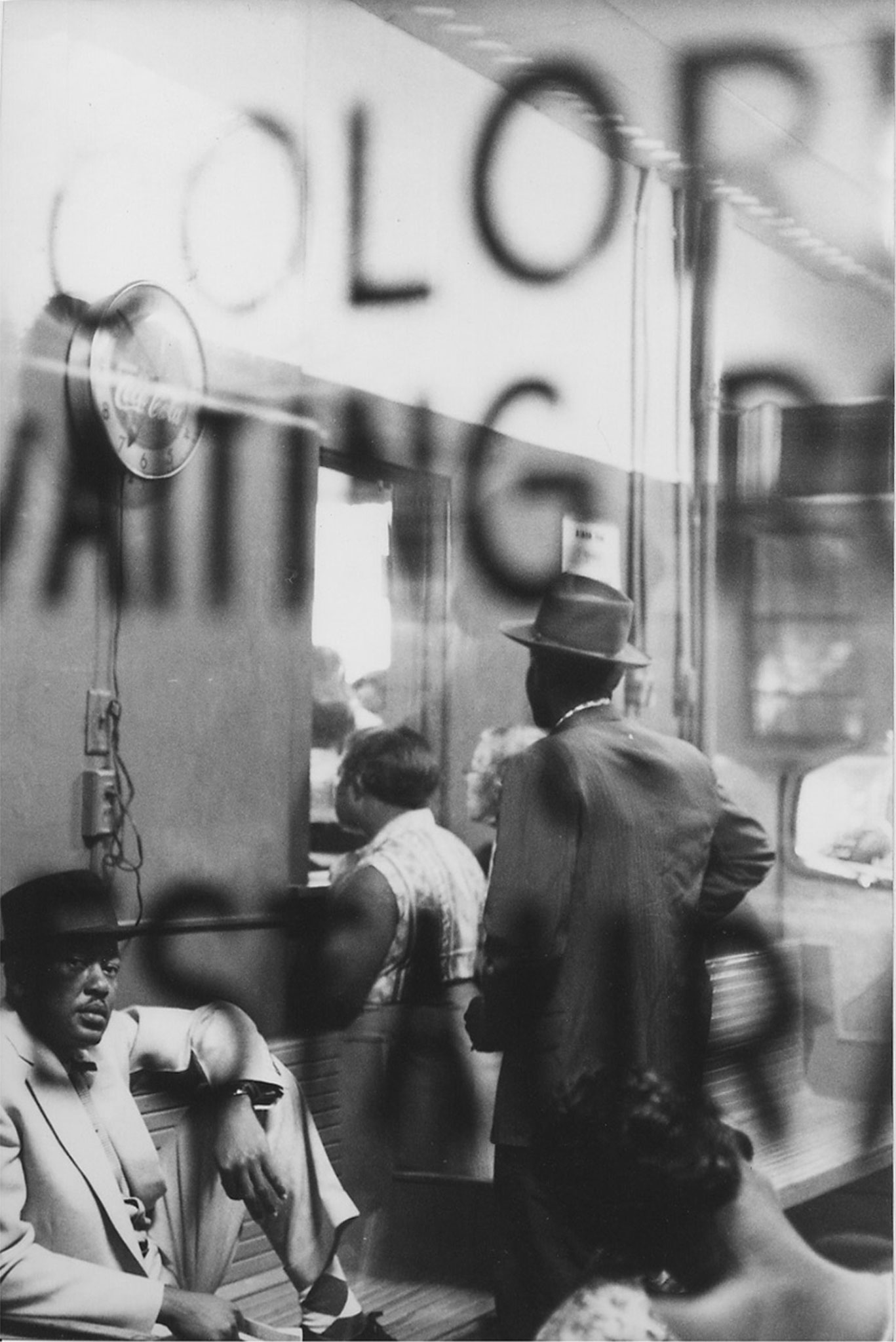 Freedom Riders wait in a 'Colored Waiting Room' in a bus station in Montgomery, Ala., May 1961. The Freedom Riders rode buses throughout the south in the months following the Boynton v. Virginia Supreme Court case, which outlawed racial segregation on public transportation, in order to test and call attention to still existing local policies that ran contrary to national laws.