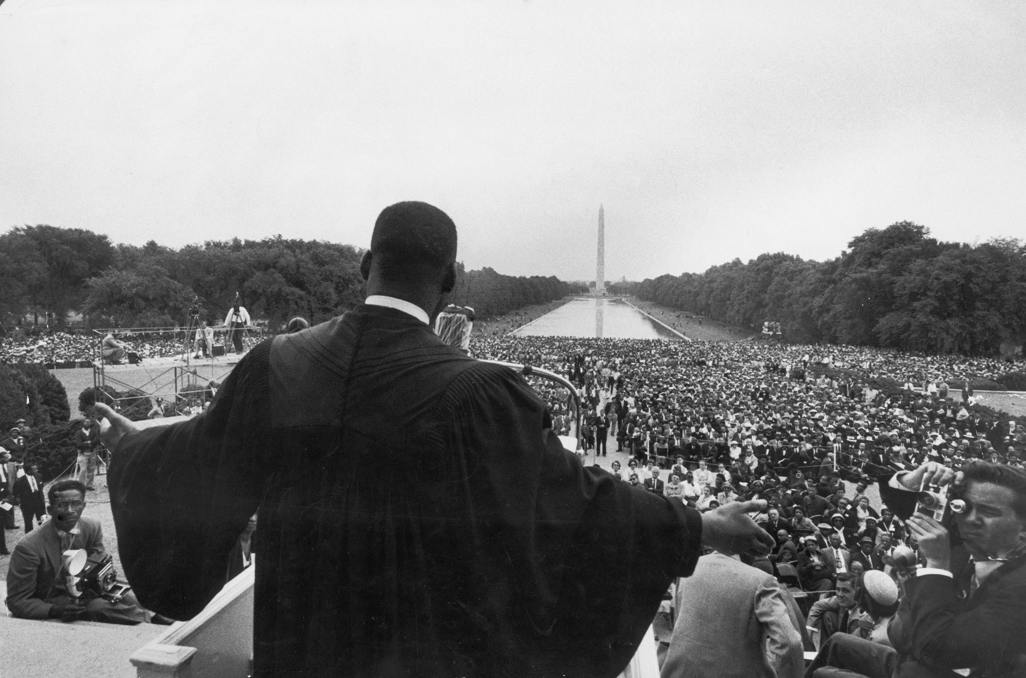 Dr. Martin Luther King Jr. speaks in front of the Lincoln Memorial before 25,000 people at the Prayer Pilgrimage for Freedom, May 1957 to mark the third anniversary of the landmark supreme court decision, Brown v. the Board of Education, which outlawed segregation in public schools. Among his landmark early addresses, King's speech that day was known as "Give Us the Ballot."