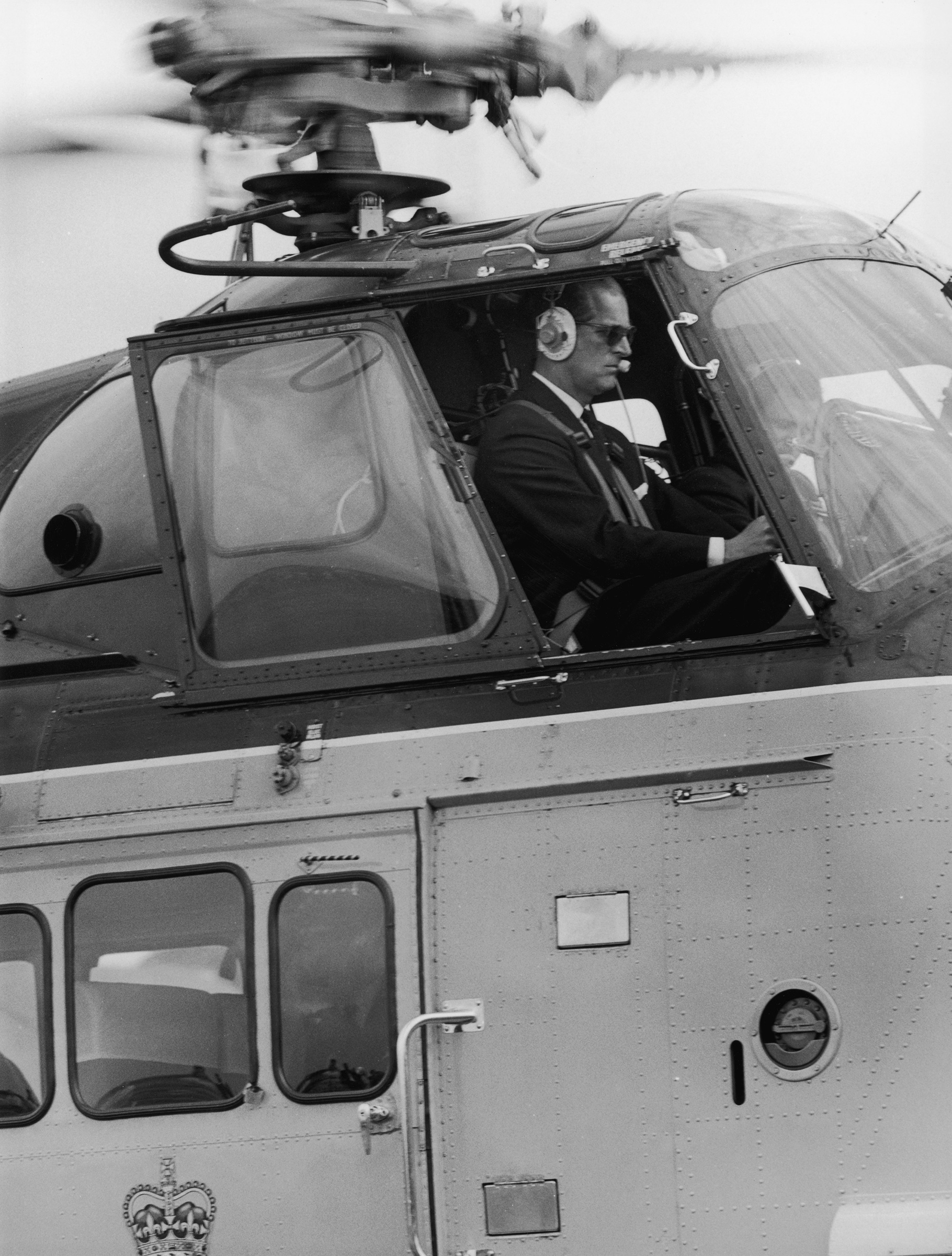 Prince Philip at the controls of the royal helicopter, July 28, 1965. (George W. Hales—Fox Photos/Hulton Archive/Getty Images)