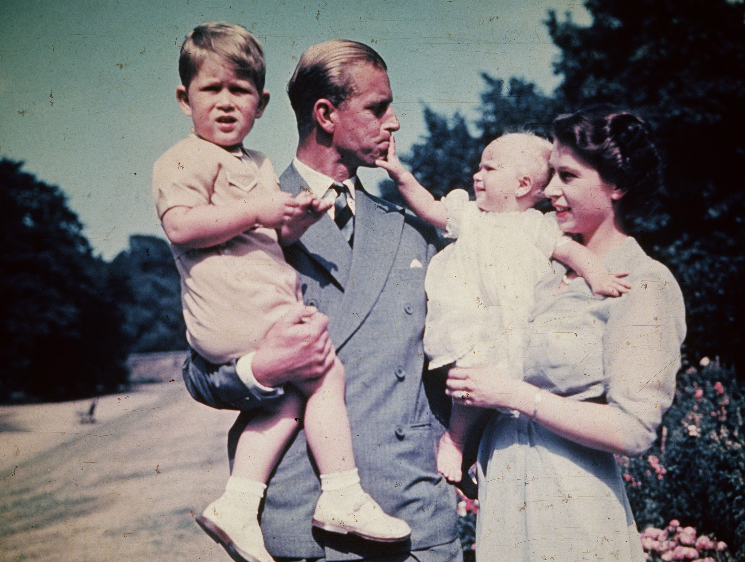 The Duke of Edinburgh and Princess Elizabeth hold their children, Prince Charles and Princess Anne, Aug. 1951. (Keystone/Hulton Archive/Getty Images)