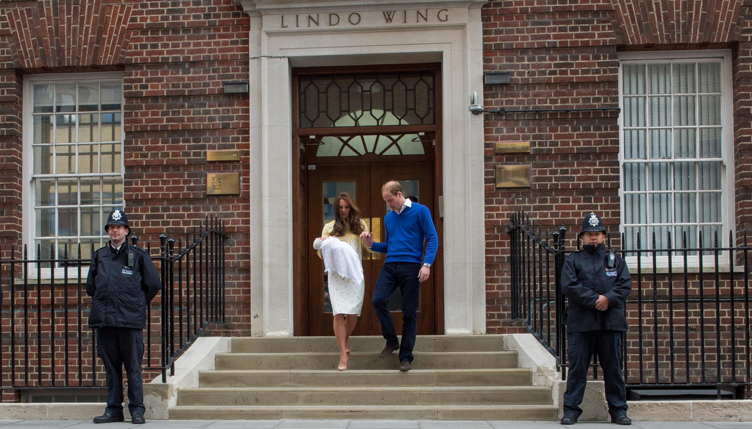 Prince William, Duke of Cambridge, and Catherine, Duchess of Cambridge, depart the Lindo Wing with their newborn baby daughter at St. Mary's Hospital in London on May 2, 2015.
