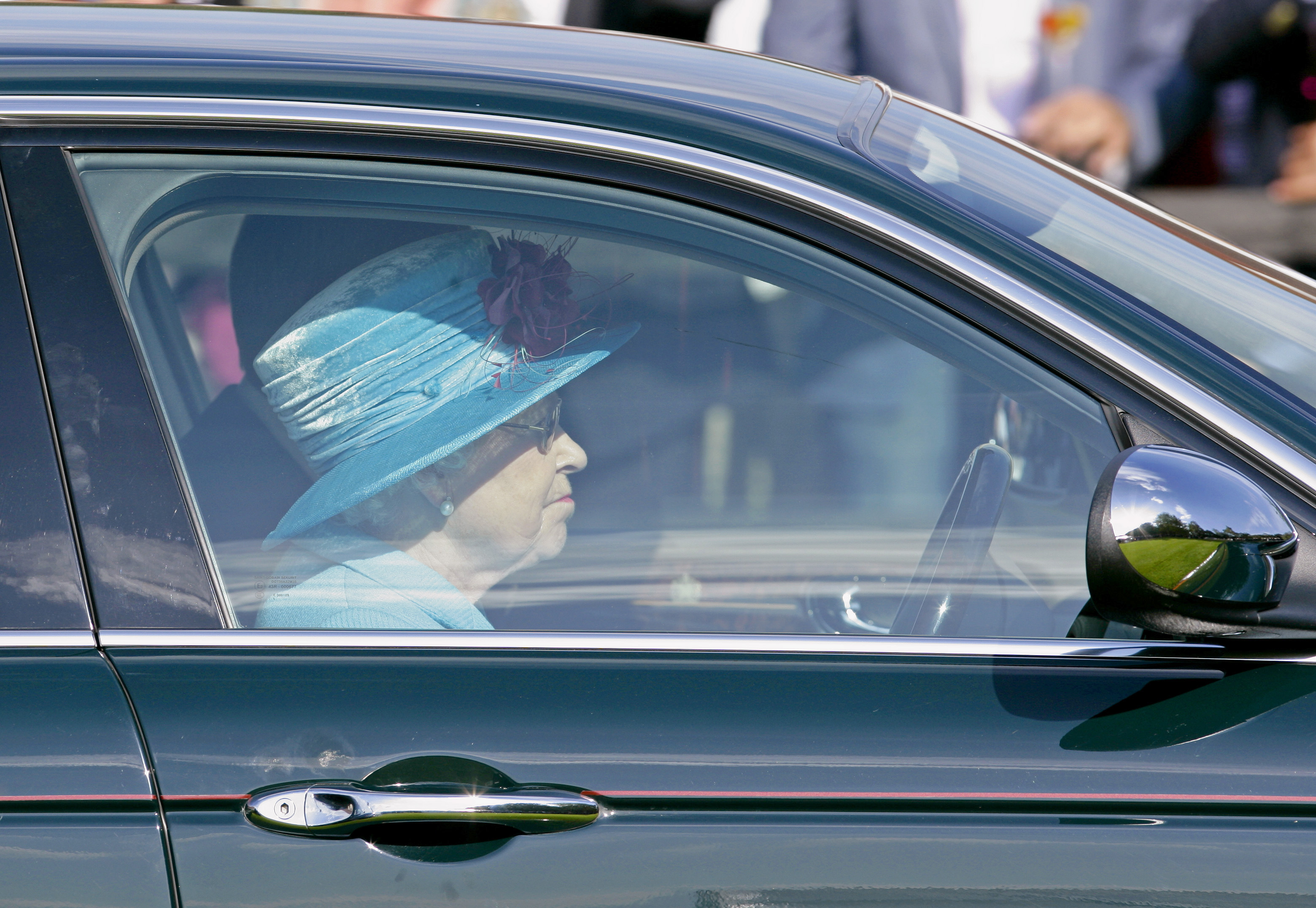 EGHAM, UNITED KINGDOM - JUNE 13: (EMBARGOED FOR PUBLICATION IN UK NEWSPAPERS UNTIL 48 HOURS AFTER CREATE DATE AND TIME) HM Queen Elizabeth II drives her Jaguar car as she leaves after watching the the final of the Harcourt Developments Queen's Cup polo tournament at Guards Polo Club on June 13, 2010 in Egham, England. (Photo by Indigo/Getty Images) (Max Mumby/Indigo&mdash;Getty Images)