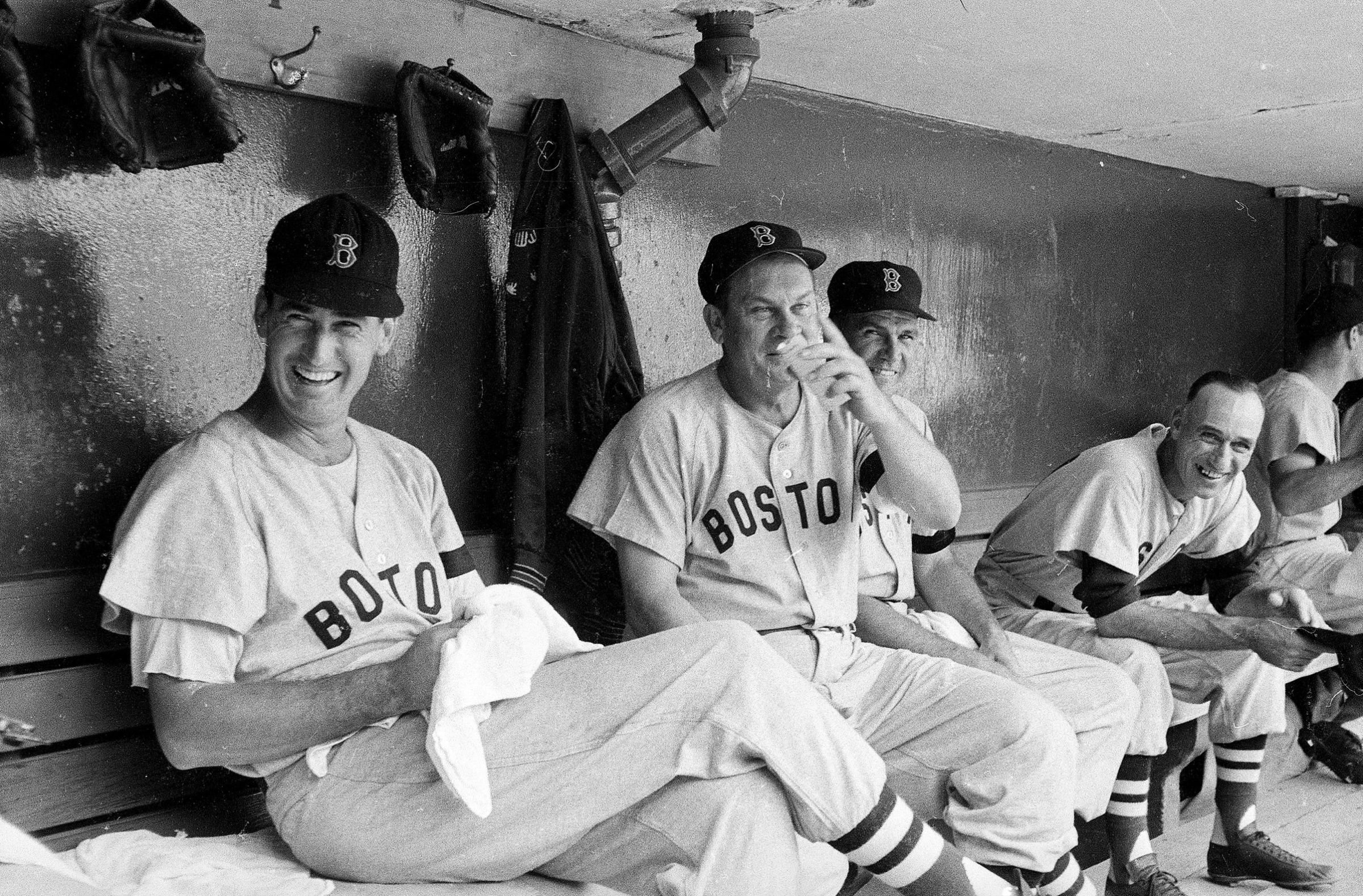 Boston Red Sox Ted Williams and Pinky Higgins in dugout during game vs Cleveland Indians. Cleveland, OH 7/16/1955.
