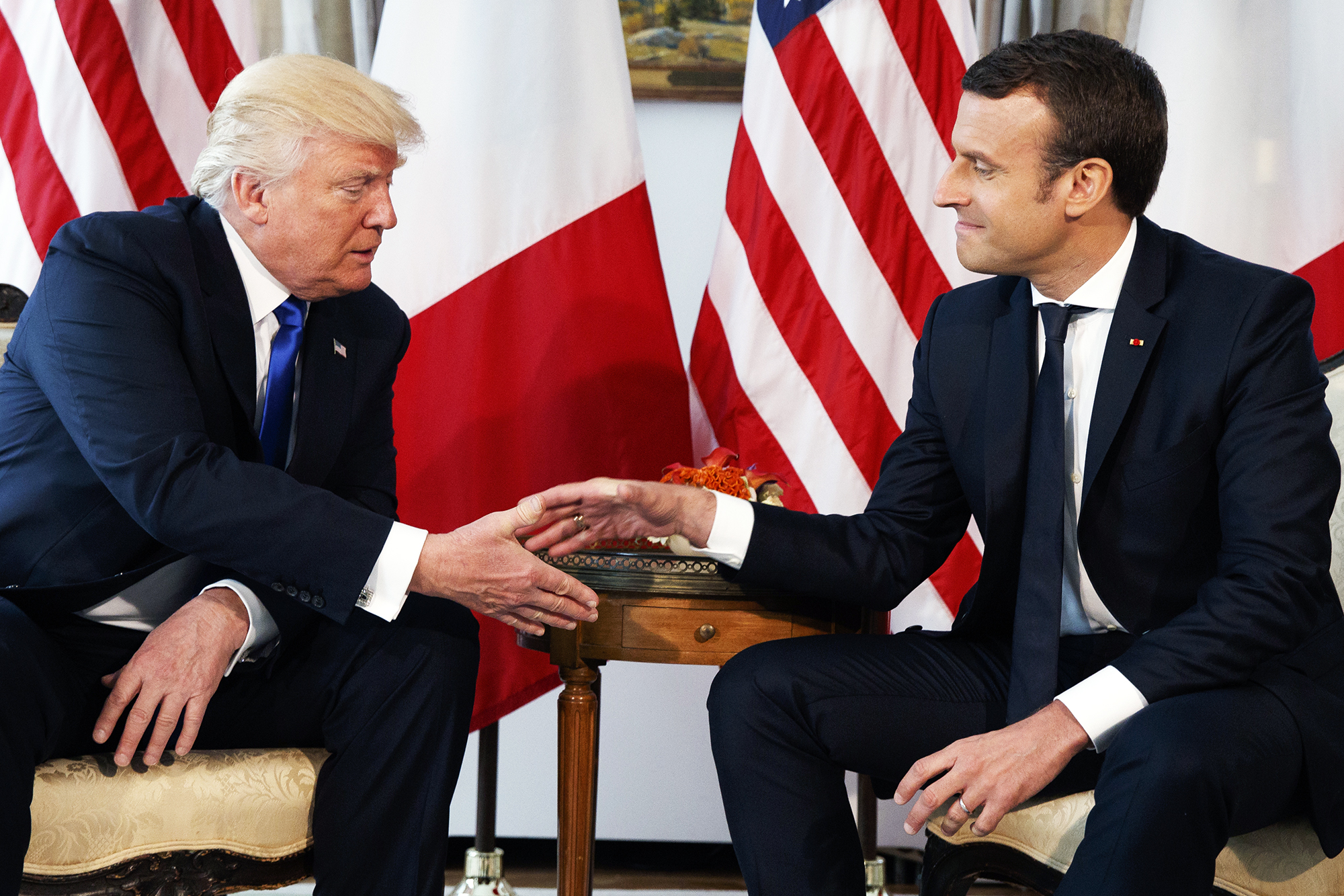 French President Emmanuel Macron gives Donald Trump a  white-knuckle  handshake in Brussels, on May 25, 2017.