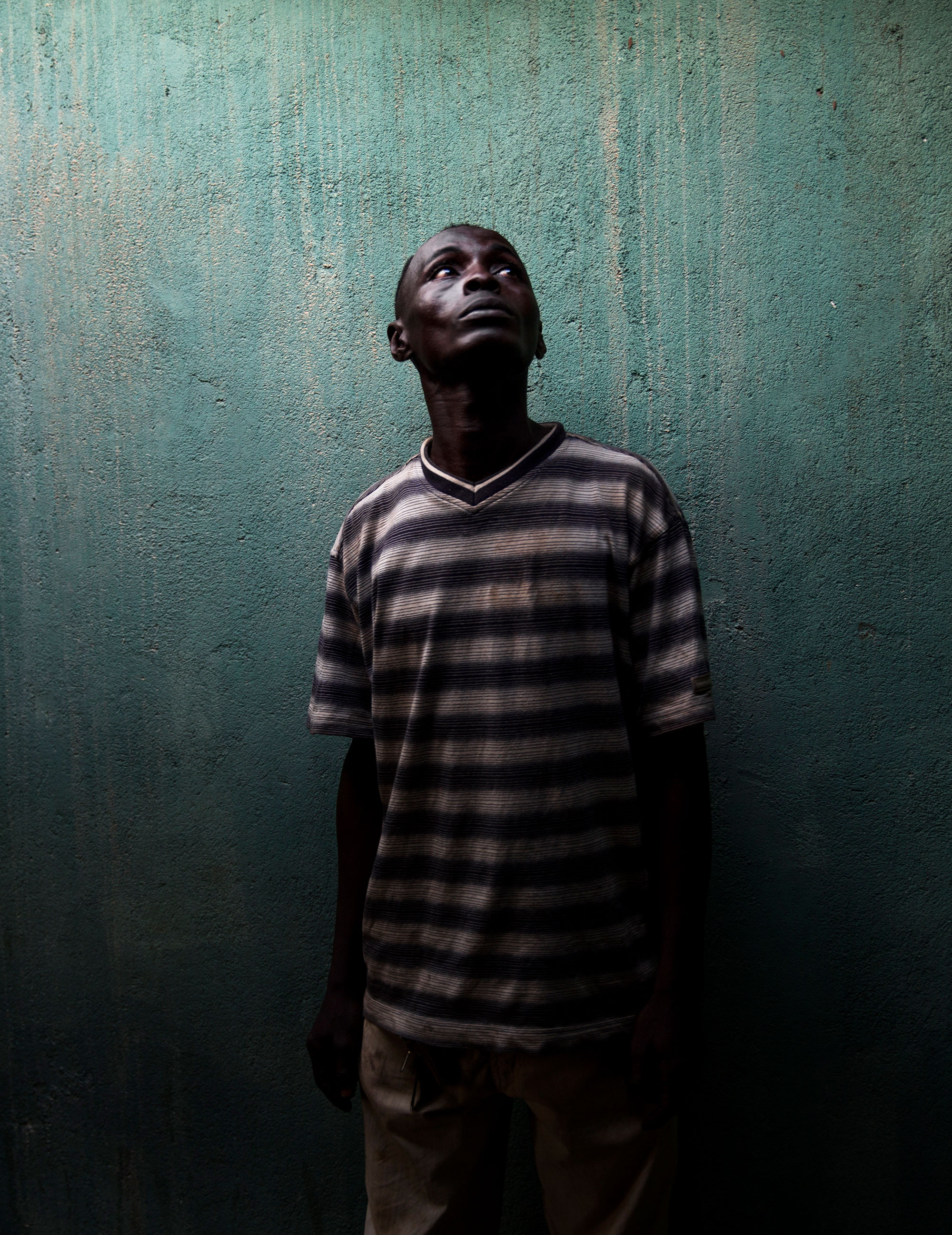 A muslim in his home, which has been looted by anti-balaka militia in Bangui.