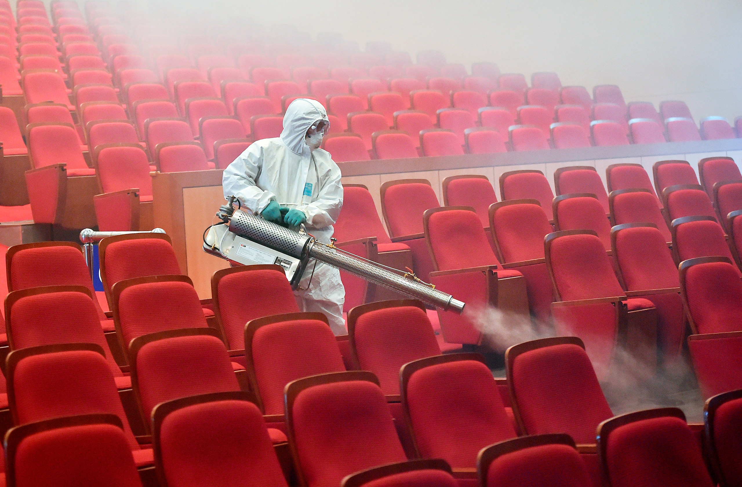 A South Korean health worker fumigates a movie theater in June 2015 after MERS cases were reported (Jung Yeon-Je—AFP/Getty Images)