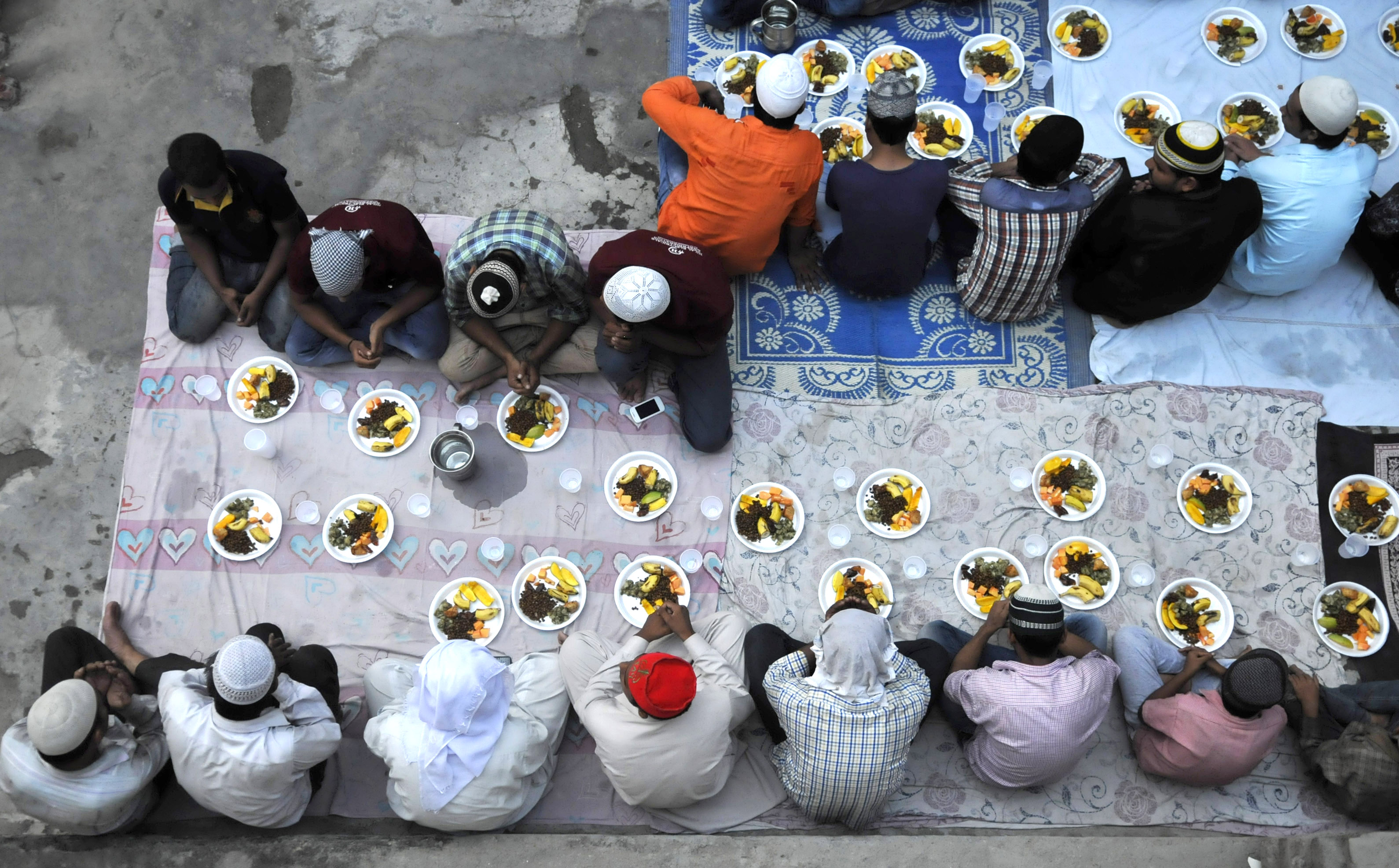 Muslims offer prayers before breaking their Roza fast with Iftar meal during the ongoing month of Ramzan on June 28, 2016 in Noida, India. (Sunil Ghosh—Hindustan Times/Getty Images)