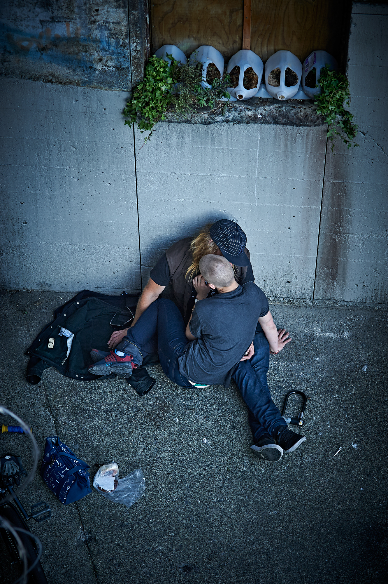 A man comforts a woman. July, 2015.