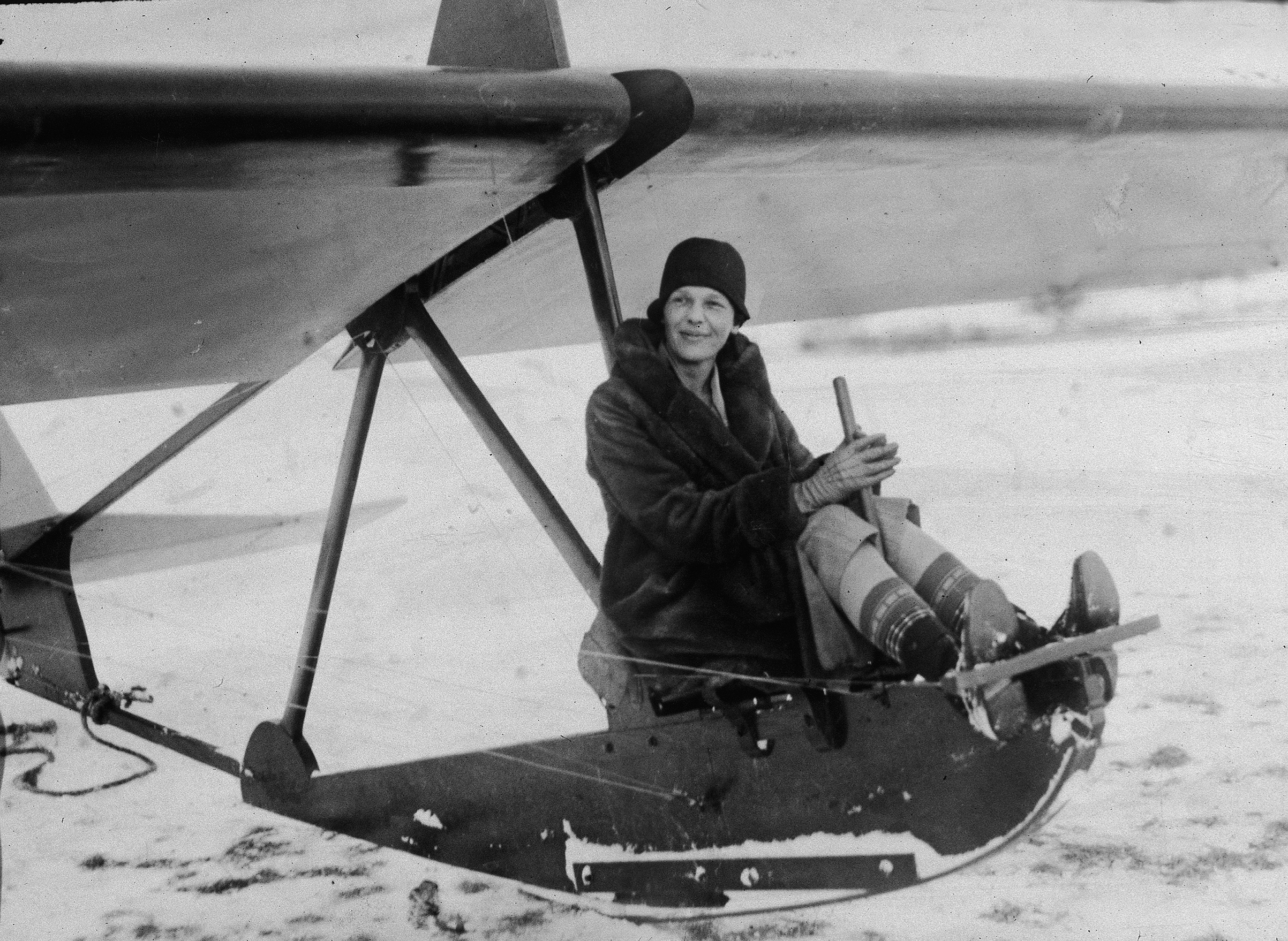 Amelia Earhart sits at the controls of an experimental glider before a flight at the Scripps estate 'Wildwood Farms,' Lake Orion, Mich., 1929.