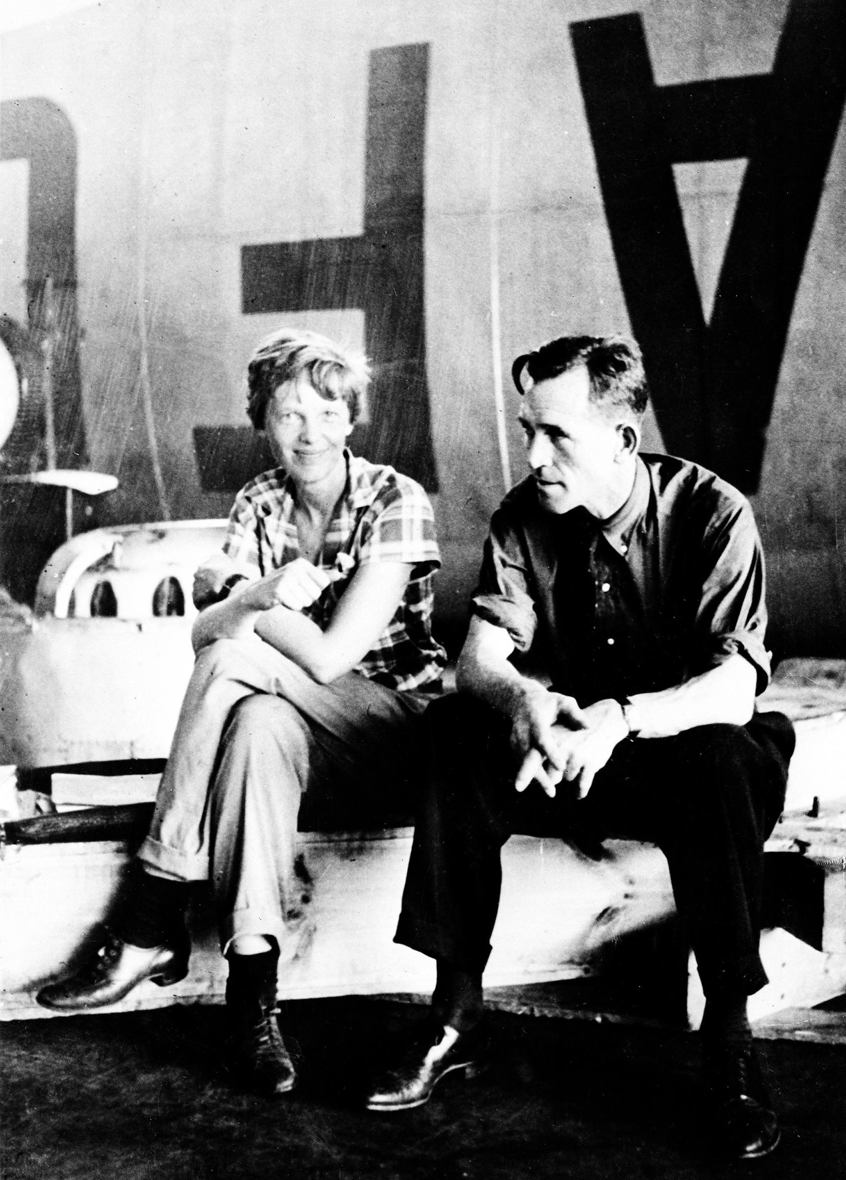 Amelia Earhart Putnam and her navigator Fred Noonan are seen shortly after their landing in Bandoeng, near Batavia in the Dutch East Indies, on June 21, 1937. It was one of the last happy landings on their attempted round-the-world flight before they disappeared on July 2, under way to Howland Island, somewhere over the Pacific Ocean.