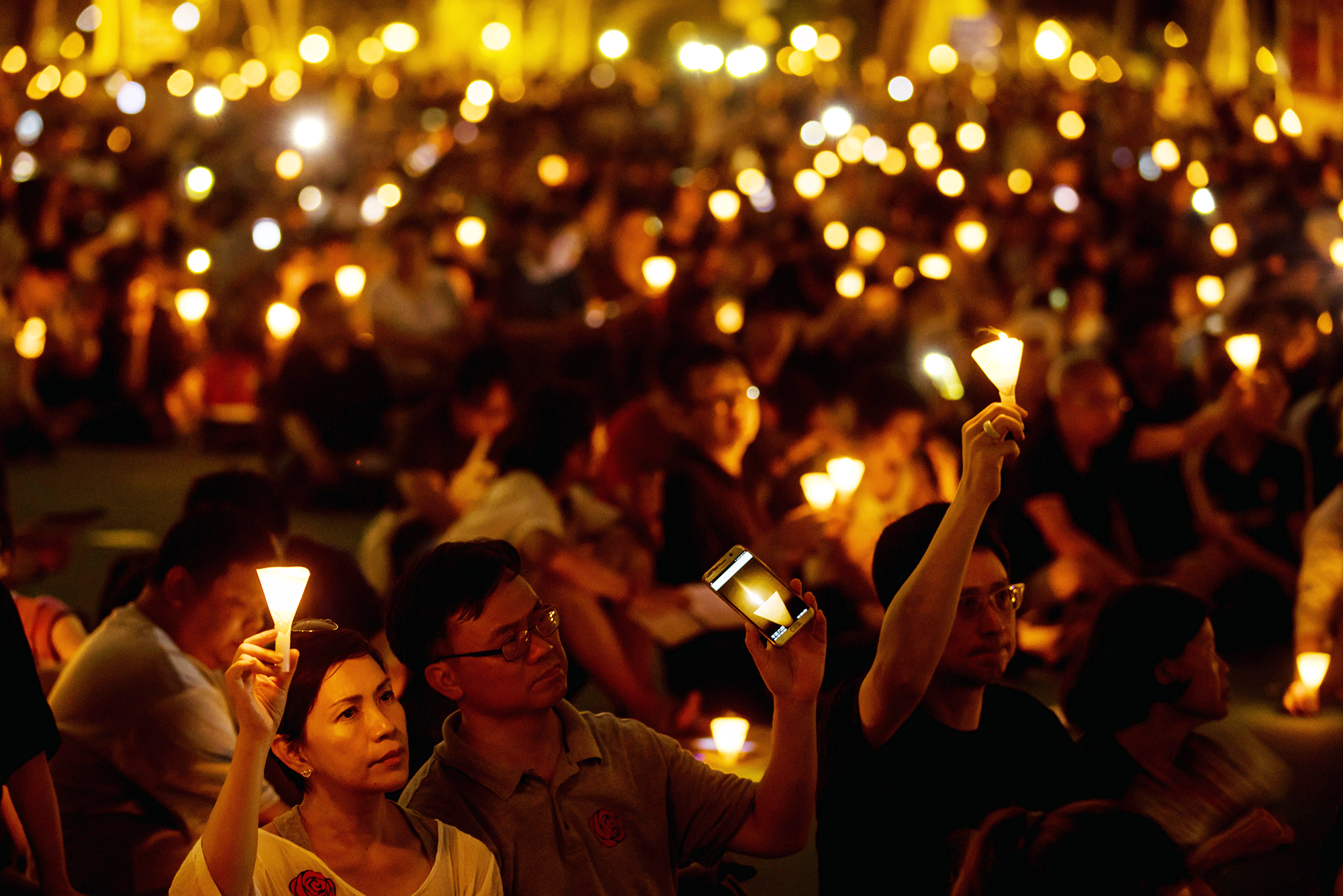 Demonstrators attend a candlelight vigil at Victoria Park in Hong Kong, on June 4, 2017. (Paul Yeung—Getty Images)