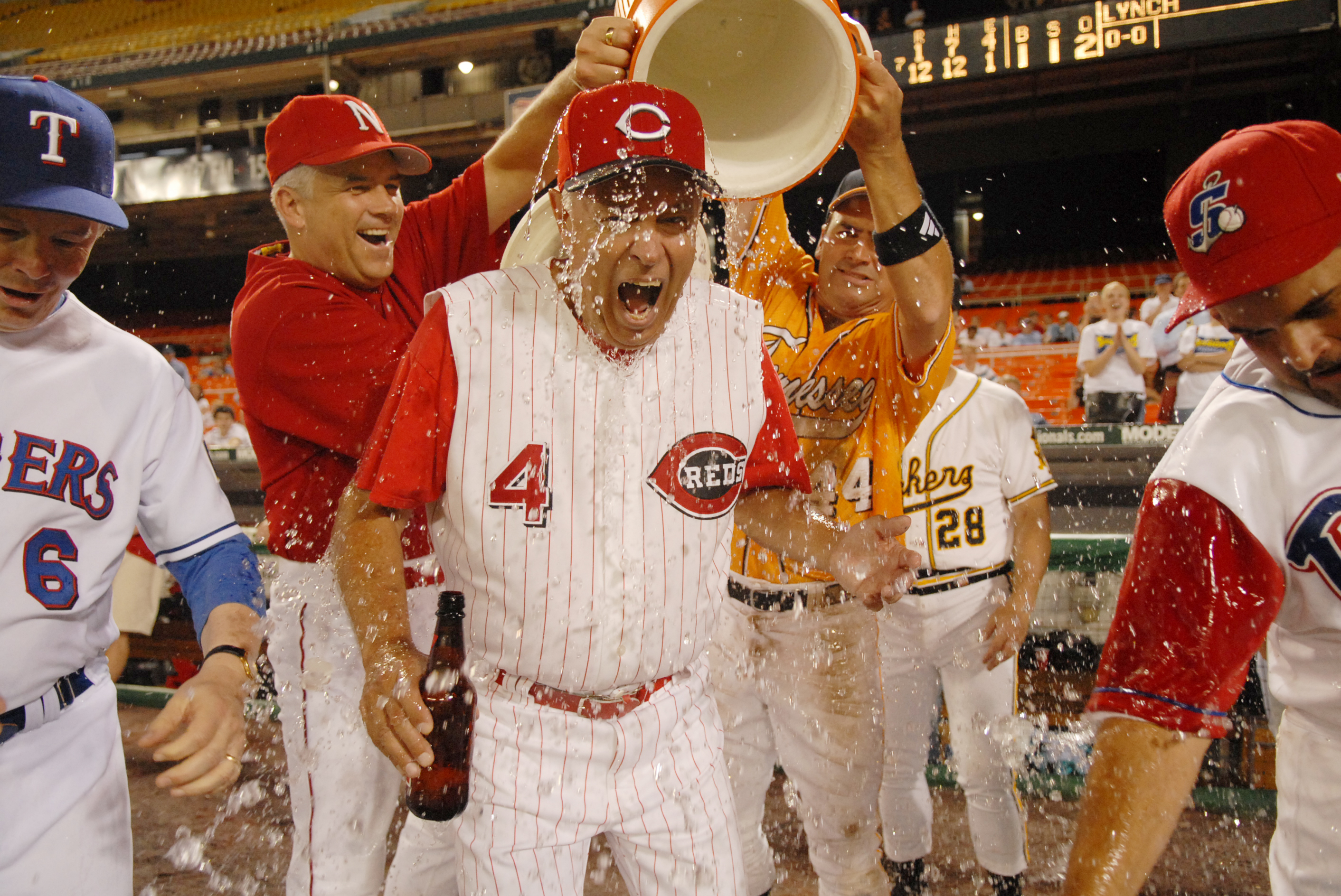 Coach Mike Oxley, R-Ohio, gets water dumped on him in celebration at the 45th Annual Roll Call Congressional Baseball game played at RFK stadium. (Tom Williams—AP)