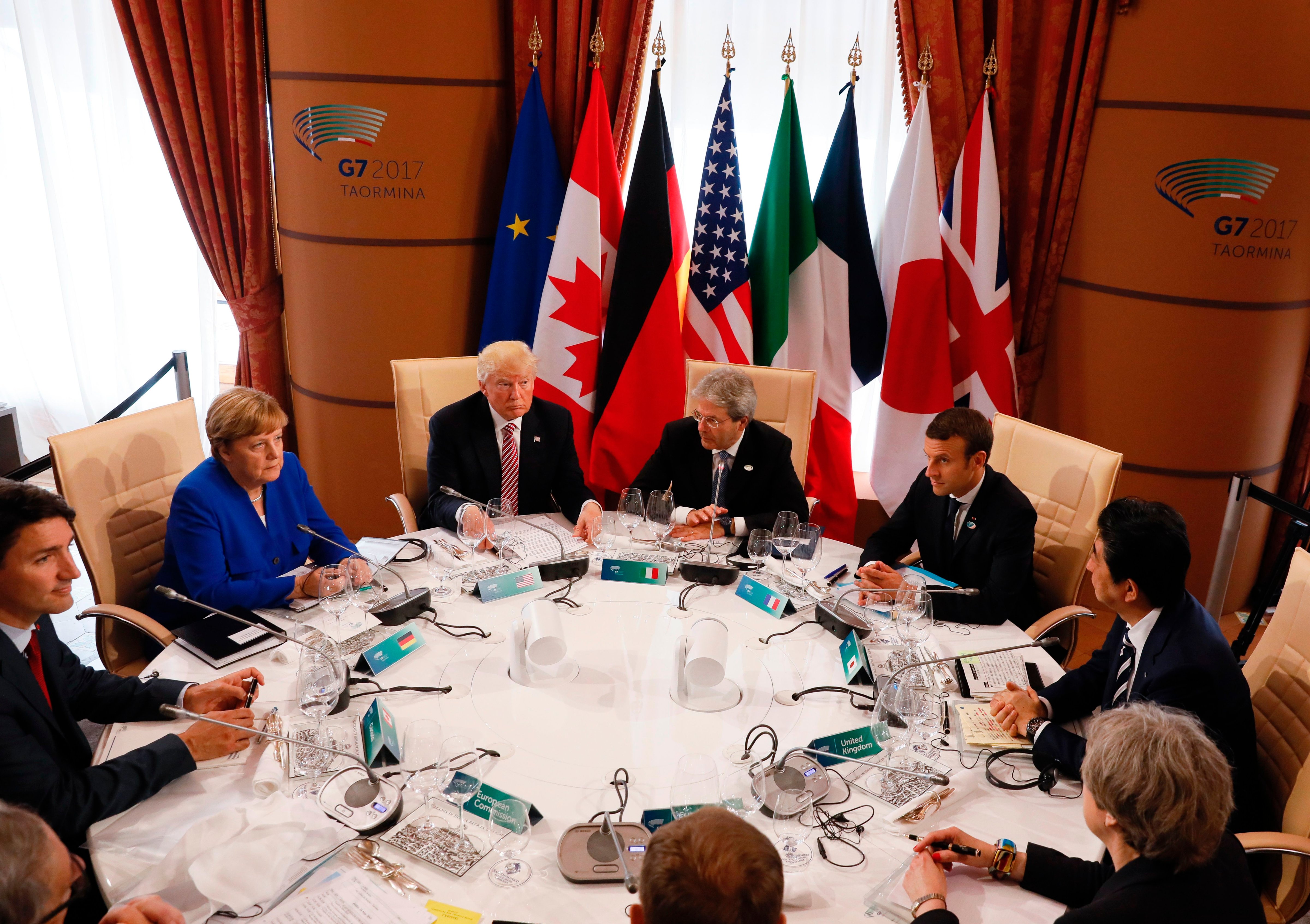 From left: Canadian Prime Minister Justin Trudeau, German Chancellor Angela Merkel, U.S. President Donald Trump, Italian Prime Minister Paolo Gentiloni, French President Emmanuel Macron, Japanese Prime Minister Shinzo Abe, Britains Prime Minister Theresa May, European Council President Donald Tusk and European Commission President Jean-Claude Juncker sit around a table during the G7 Summit of the Heads of State and of Government in Taormina, Sicily, on May 26, 2017. (Jonathan Ernst&mdash;AFP/Getty Images)