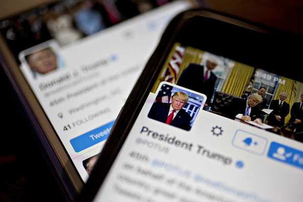 The Twitter Inc. accounts of U.S. President Donald Trump, @POTUS and @realDoanldTrump, are seen on an Apple Inc. iPhone arranged for a photograph in Washington, D.C., U.S., on Friday, Jan. 27, 2017. (Bloomberg—Bloomberg via Getty Images)