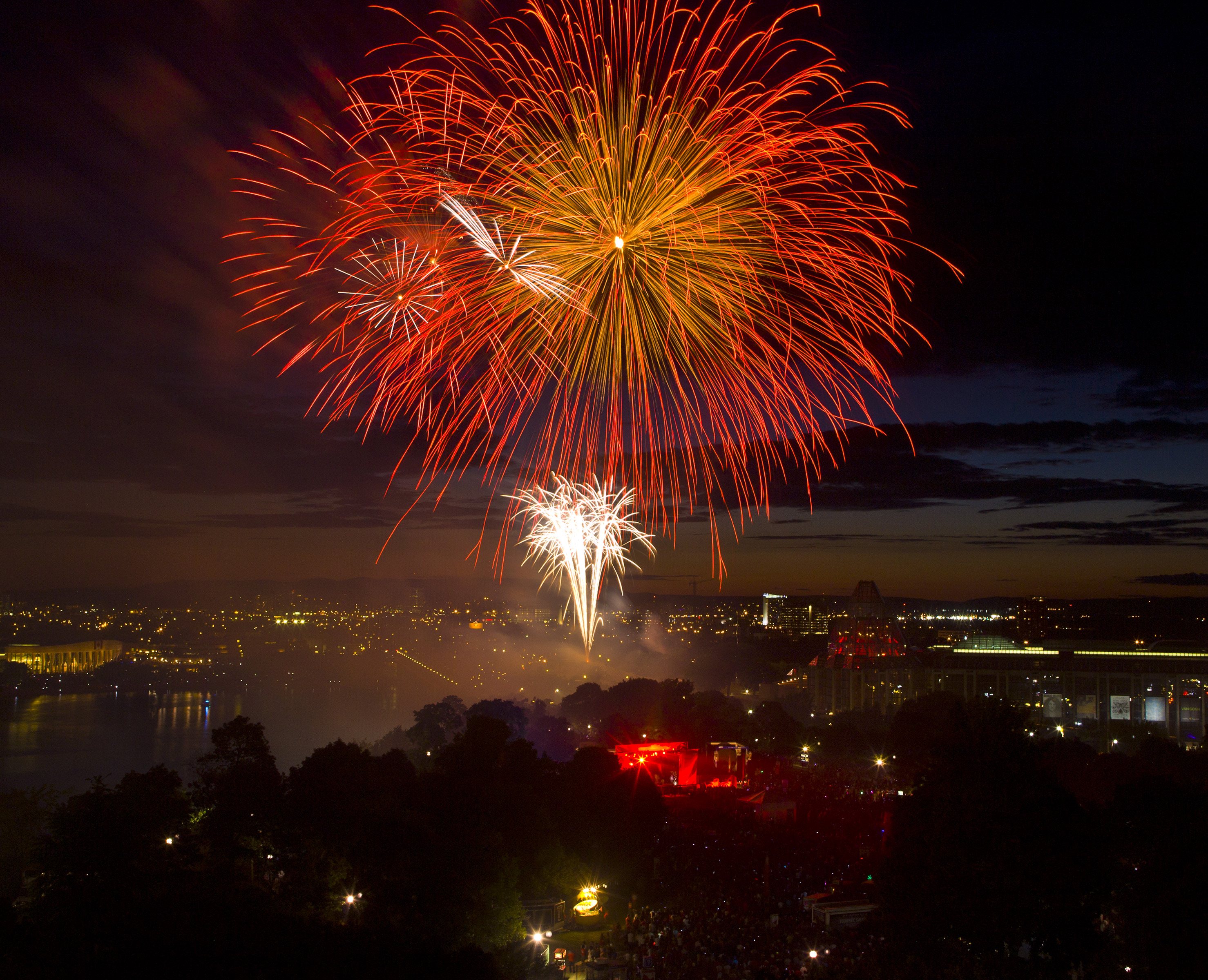 A fireworks display over the Alexandra Bridge and National Gallery as viewed from Parliament Hill as thousands gather to celebrate Canada Day on July 1, 2012, in Ottawa, Canada. (George Rose—Getty Images)