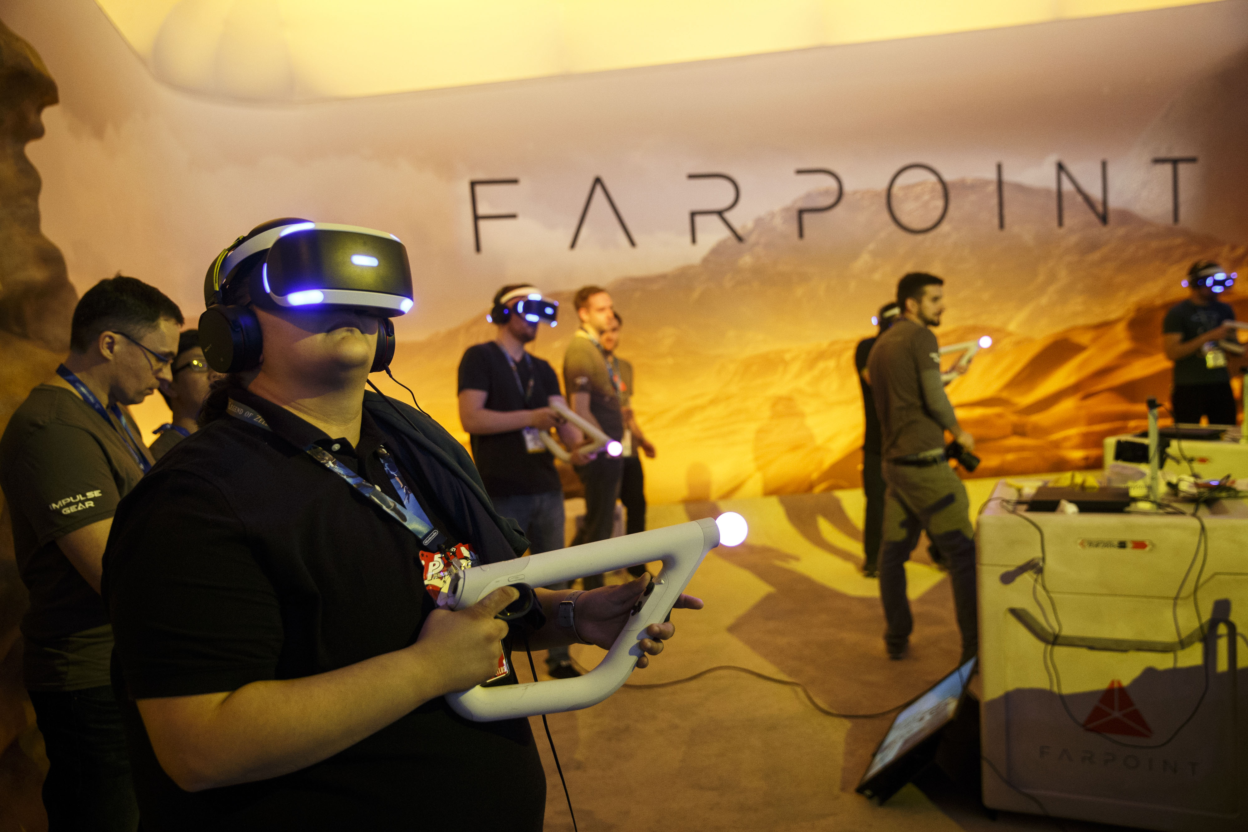 Attendees use Sony Corp. PlayStation virtual reality (VR) Aim Controllers and headsets to play "Farpoint" during the E3 Electronic Entertainment Expo in Los Angeles, California, U.S., on Wednesday, June 15, 2016. E3, a trade show for computer and video games, draws professionals to experience the future of interactive entertainment as well as to see new technologies and never-before-seen products. Photographer: Patrick T. Fallon/Bloomberg via Getty Images (Bloomberg&mdash;Bloomberg via Getty Images)