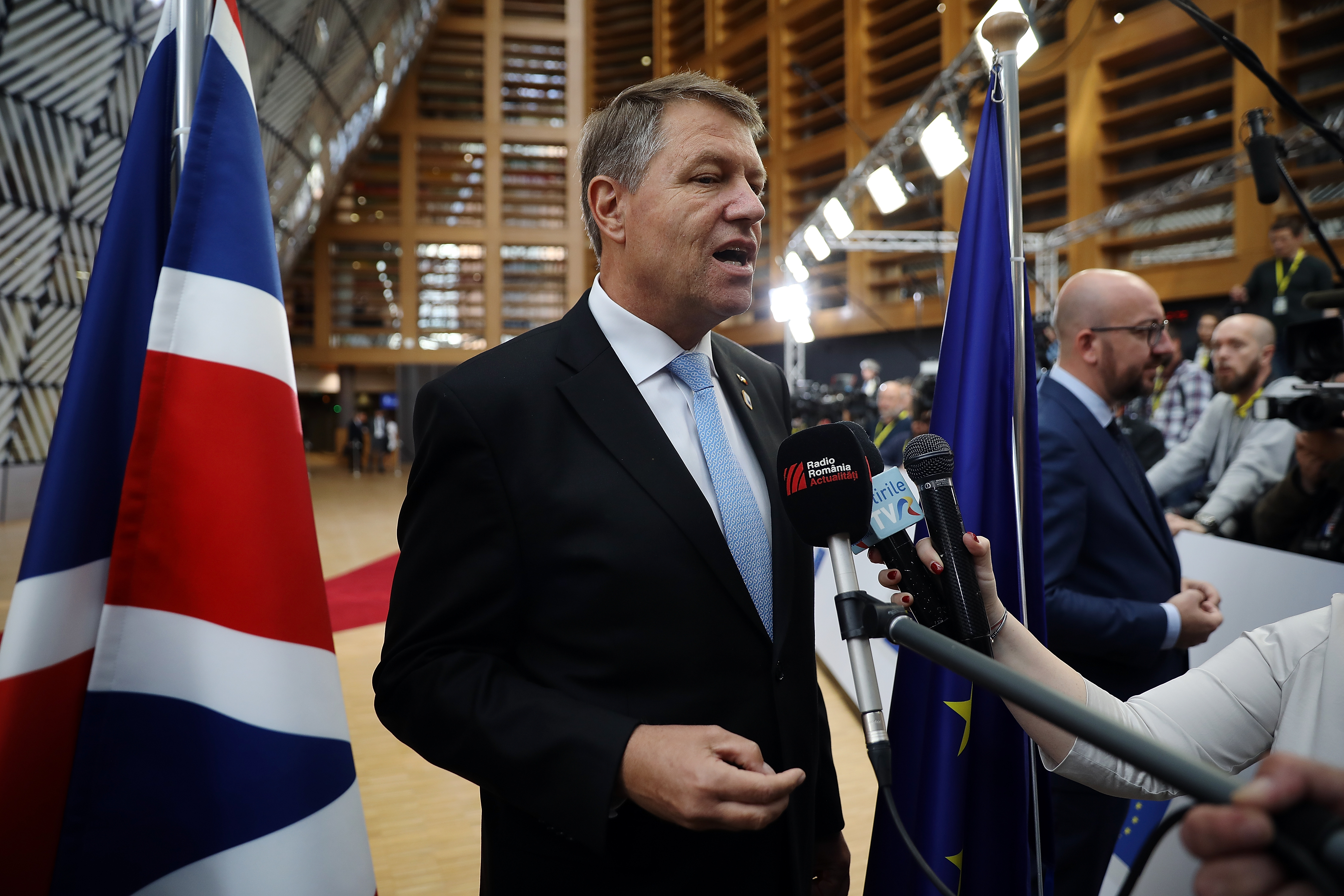 Romanian President Klaus Werner Iohannis speaks to the media as he arrives at the Council of the European Union ahead of an EU Council meeting on April 28, 2017 in Brussels, Belgium. (Dan Kitwood—Getty Images)