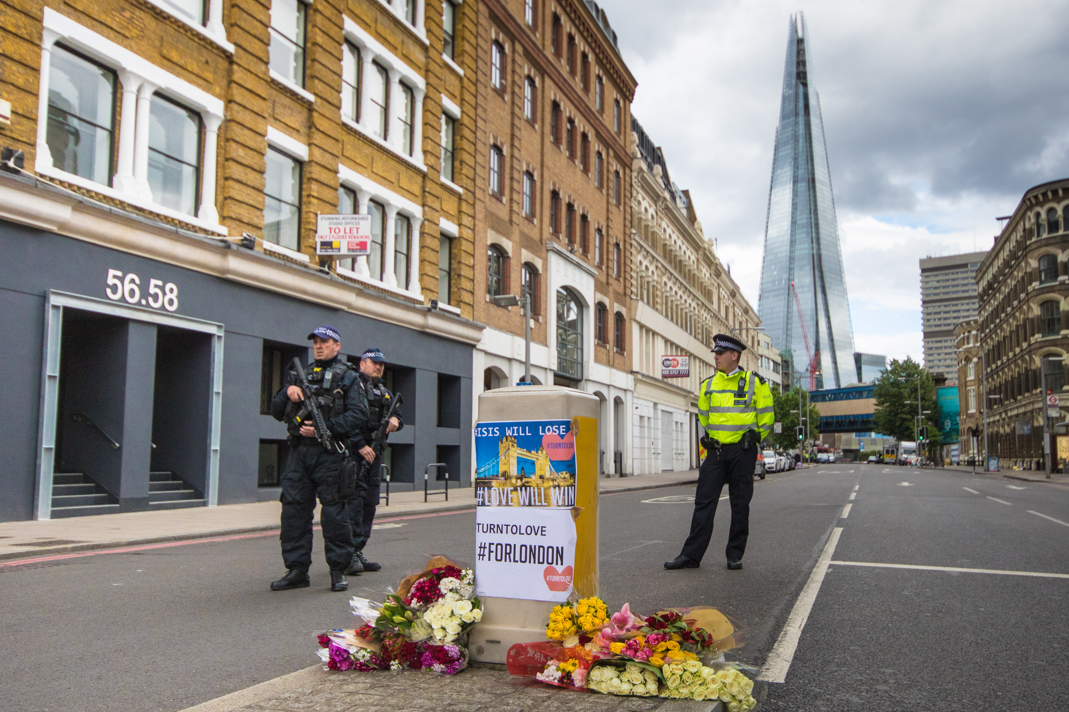 Armed police patrol the perimeter of the scene of the attack on London Bridge and Borough Market, June 4, 2017 in London. (Paul Davey—Barcroft Media/Getty Images)