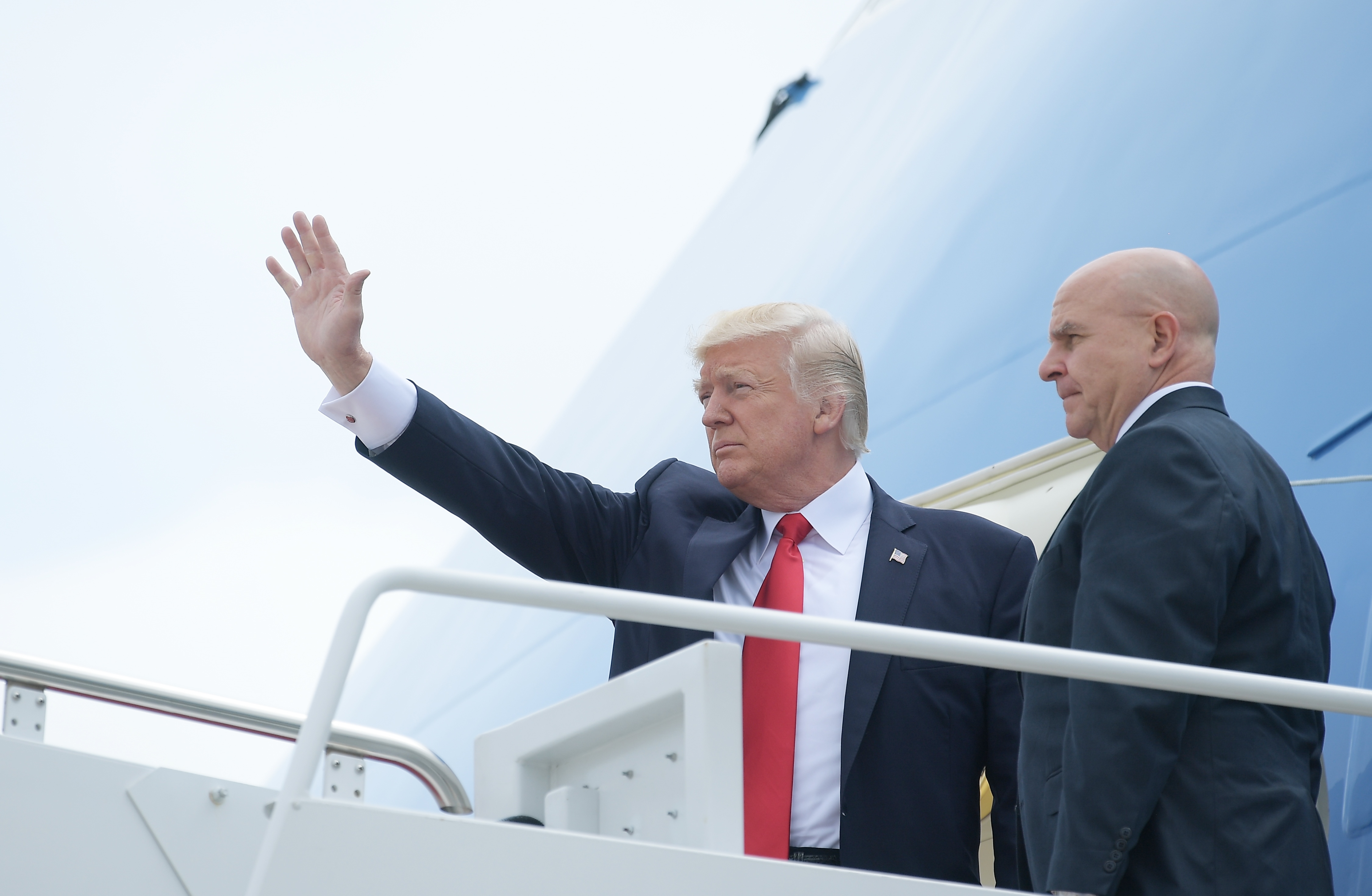 US President Donald Trump and National Security Advisor H. R. McMaster board Air Force One before departing from Andrews Air Force Base for Miami, Florida on June 16, 2017. (Photograph by Mandel Ngan—Getty/AFP)