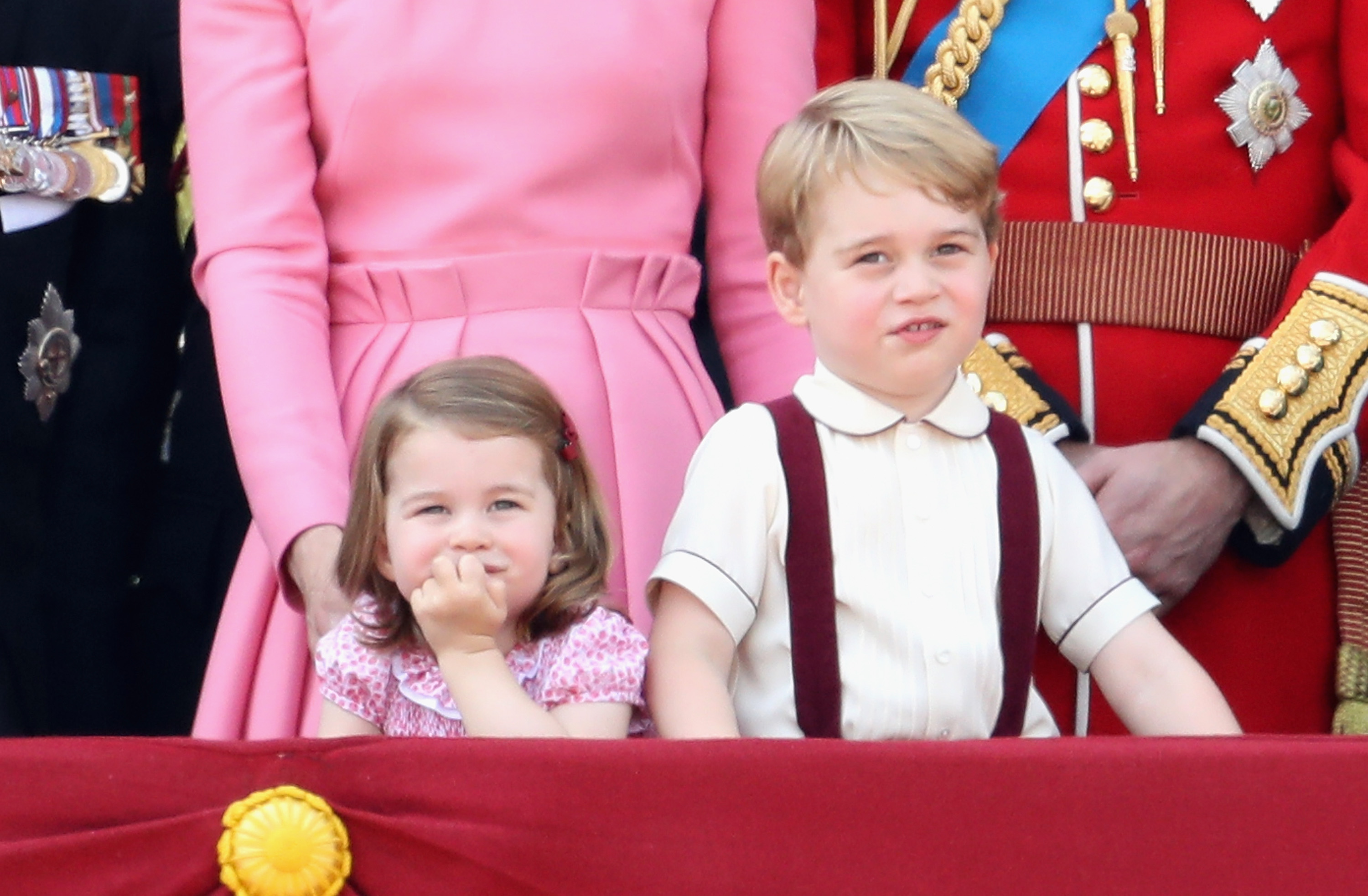 (L-R) Catherine, Duchess of Cambridge, Princess Charlotte of Cambridge, Prince George of Cambridge and Prince William, Duke of Cambridge look out from the balcony of Buckingham Palace during the Trooping the Colour parade on June 17, 2017 in London, England. (Chris Jackson—Getty)