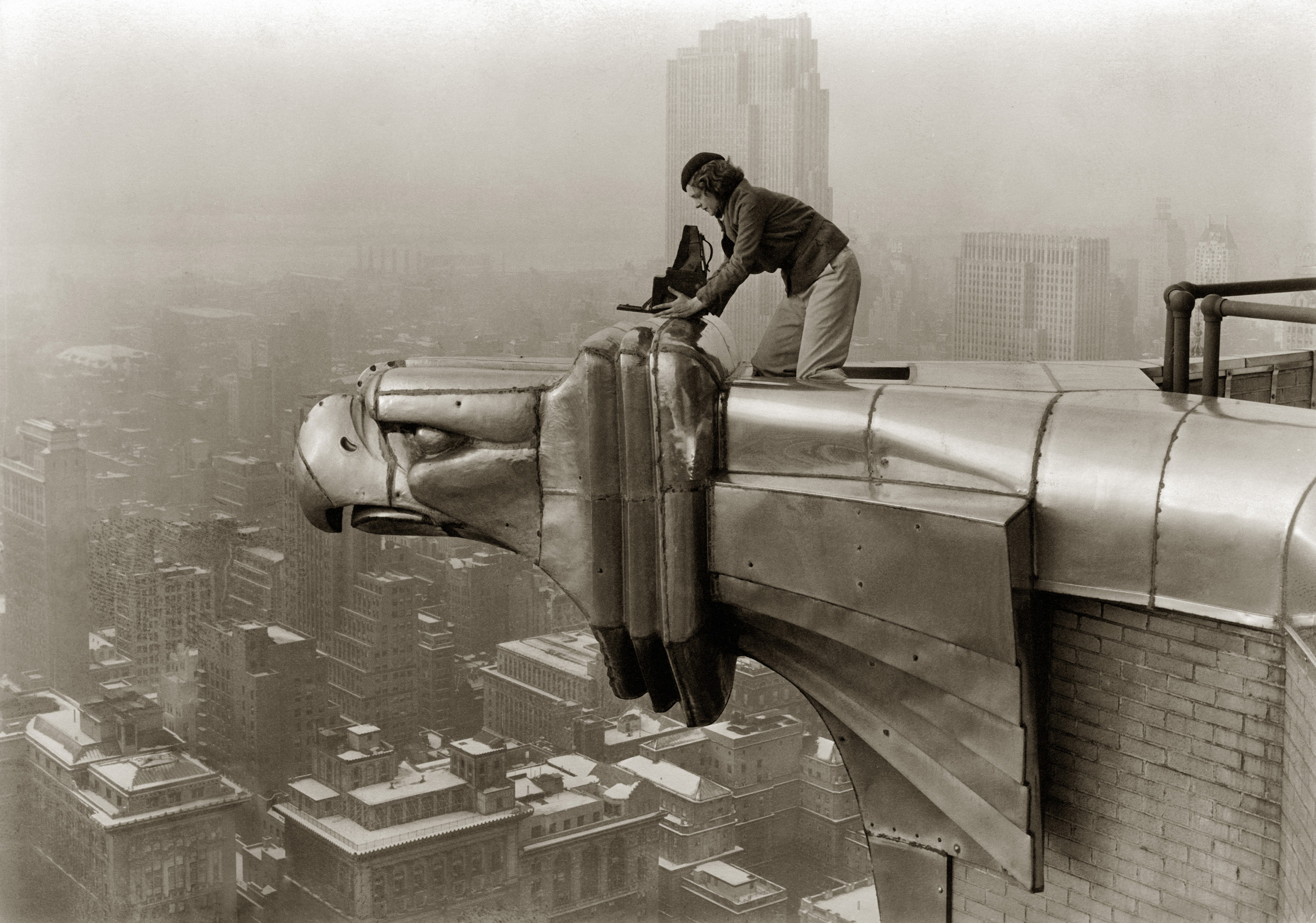 LIFE photographer Margaret Bourke-White making a precarious photo from the Chrysler Building. (Oscar Graubner—The LIFE Images Collection/Getty)