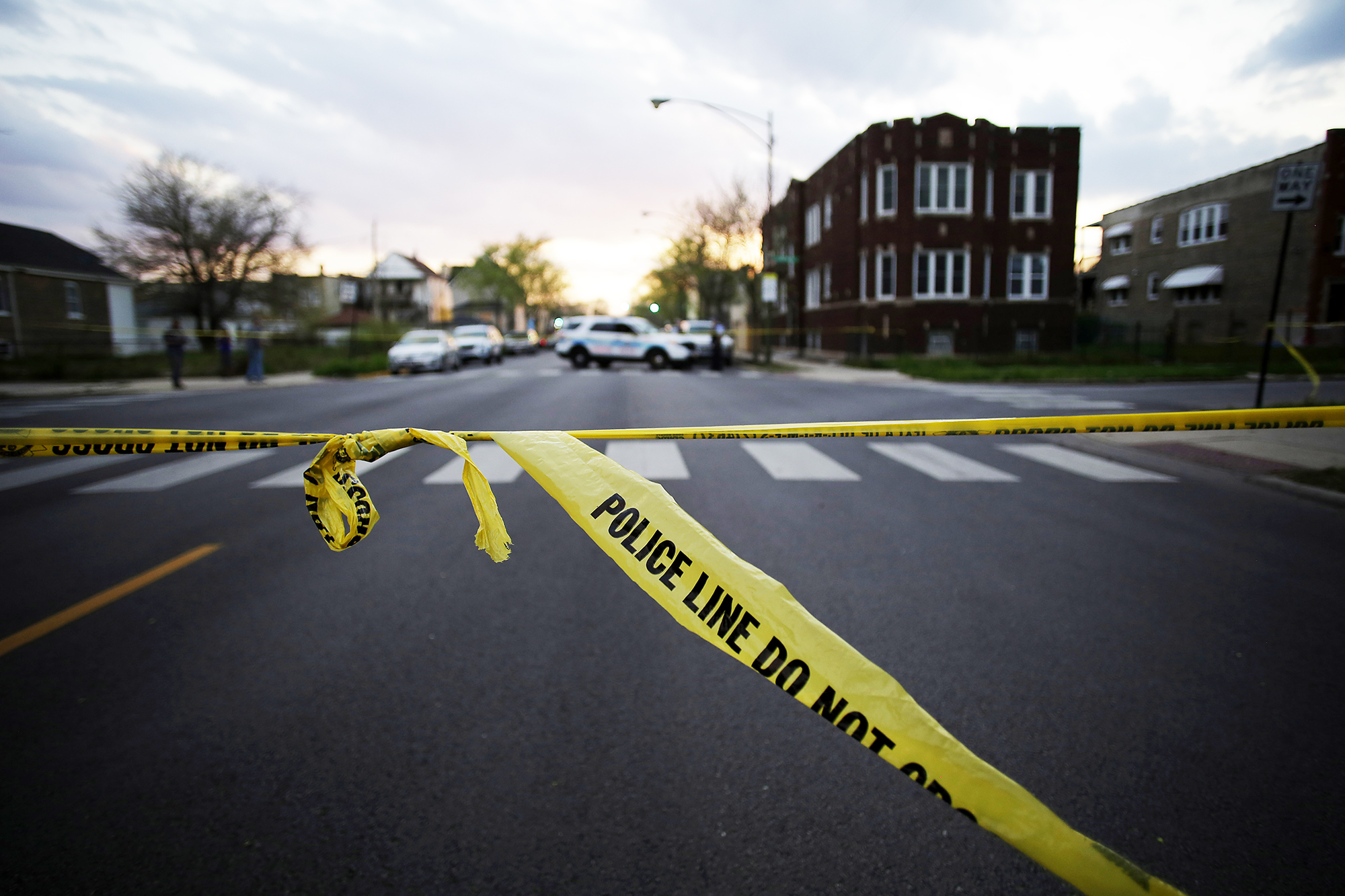 Chicago Police crime tape is displayed at the scene where a 16-year-old boy was shot in the head and killed and another 18-year-old man was shot and wounded, on April 25, 2016 in Chicago. (Joshua Lott—Getty Images)