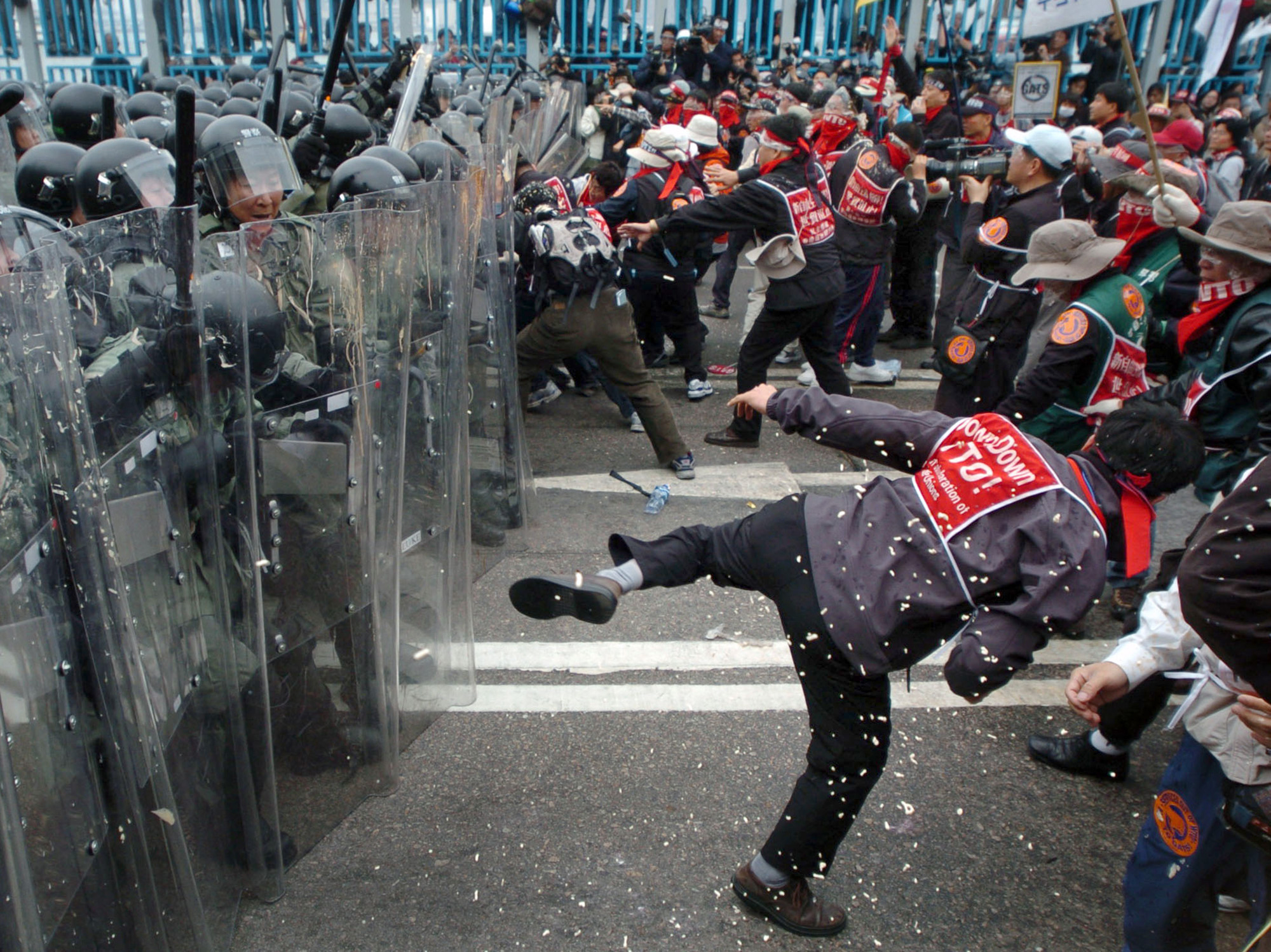 South Korean trade unionists scuffle with riot police during protests against the World Trade Organization's Sixth Ministerial Conference in Hong Kong on Dec. 14, 2005.