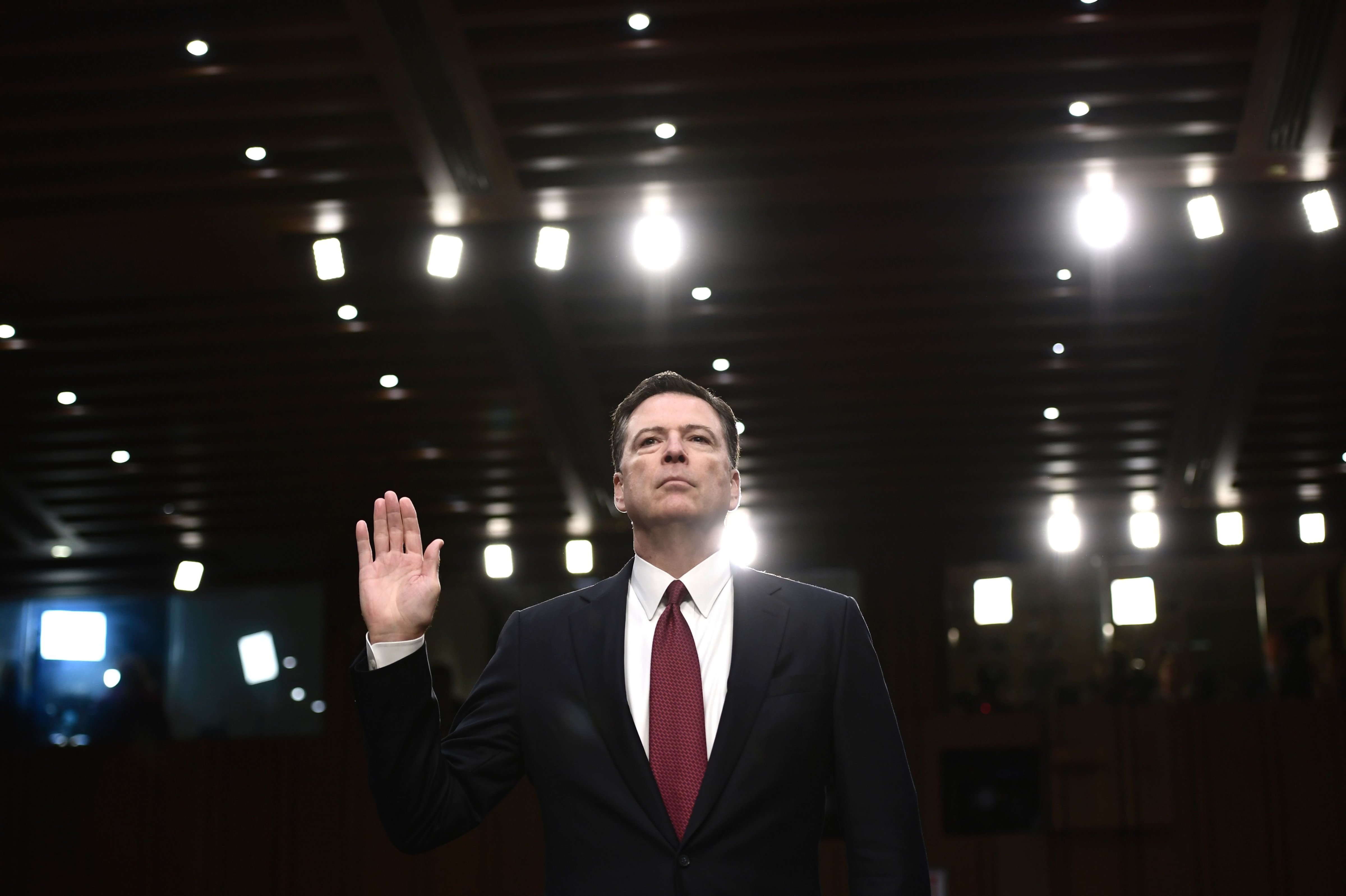 Former FBI Director James Comey takes the oath before he testifies during a US Senate Select Committee on Intelligence hearing on Capitol Hill in Washington, DC, June 8, 2017. (Brendan Smialowski—AFP/Getty Images)