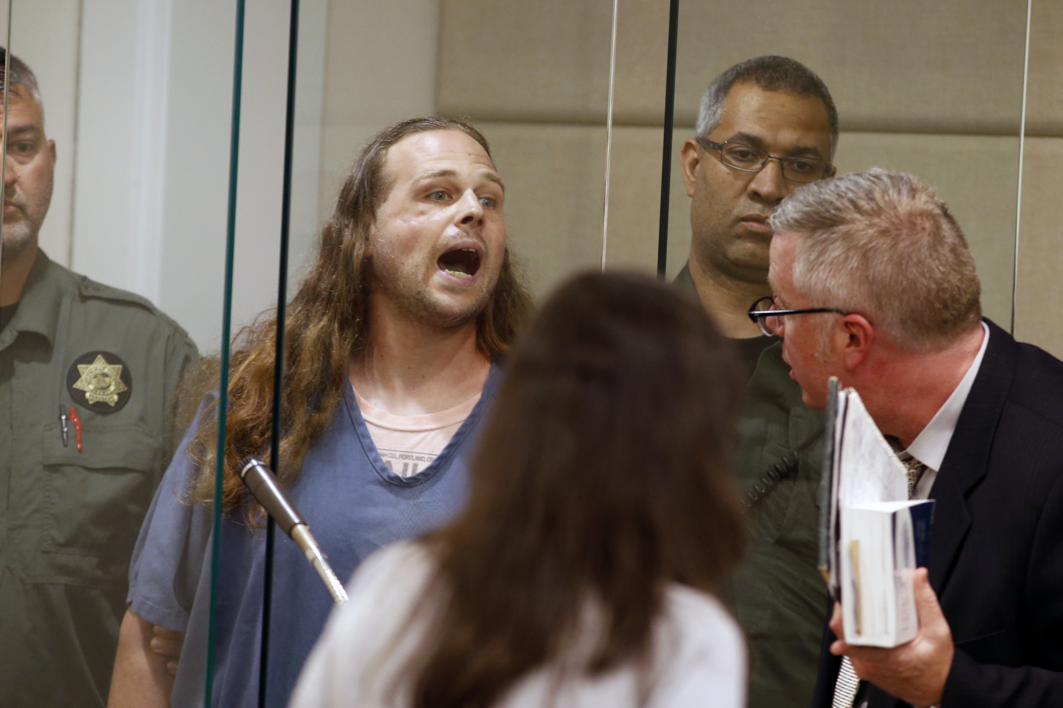 Jeremy Joseph Christian shouts as he is arraigned in Multnomah County Circuit Court in Portland, Ore., Tuesday, May 30, 2017. Authorities say Christian started verbally abusing two young women, including one wearing a hijab. When three men on the train intervened, police say, Christian attacked them, killing two and wounding one. (Beth Nakamura&mdash;AP)