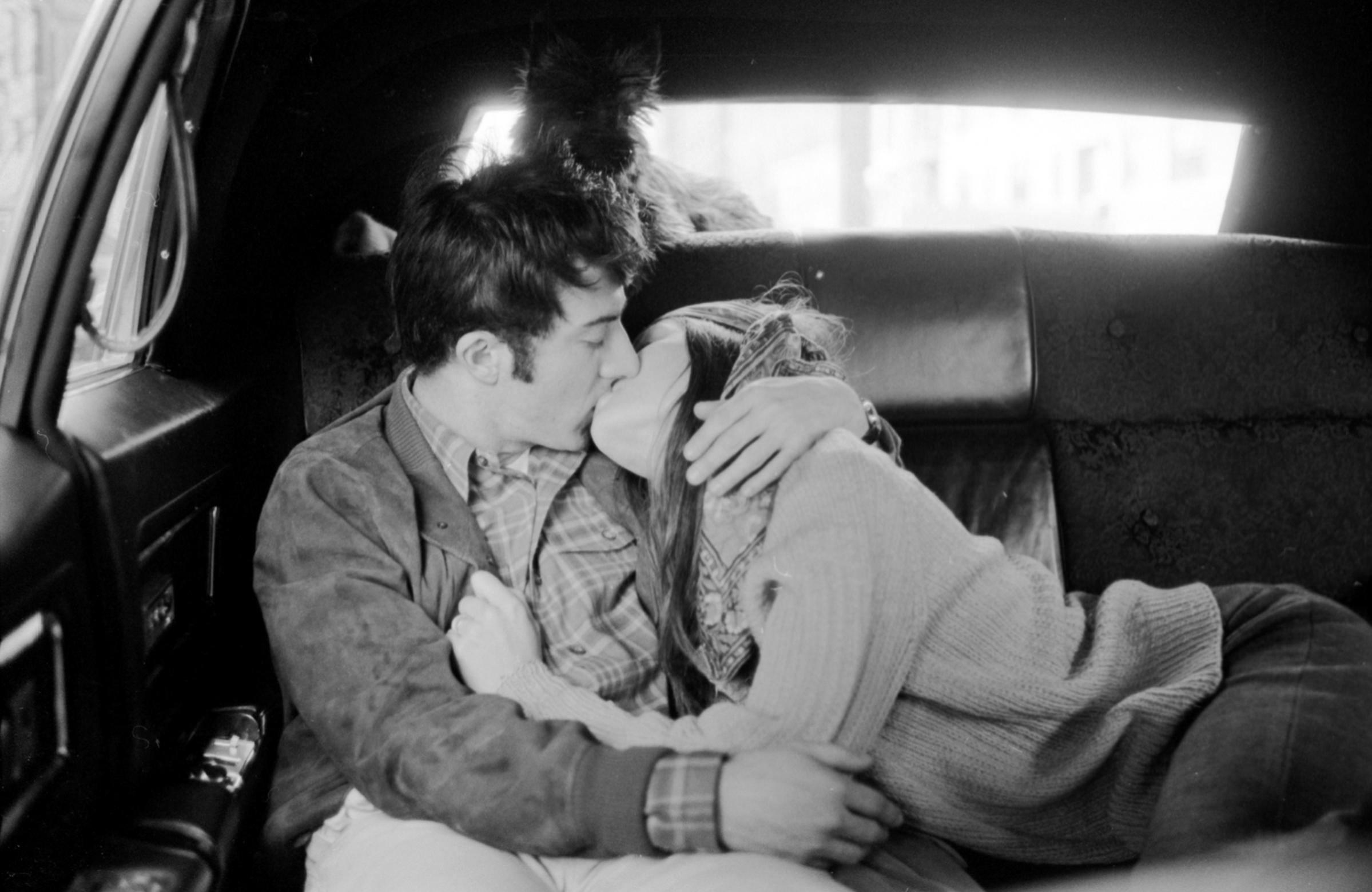 Dustin Hoffman kissing his wife, 1969.