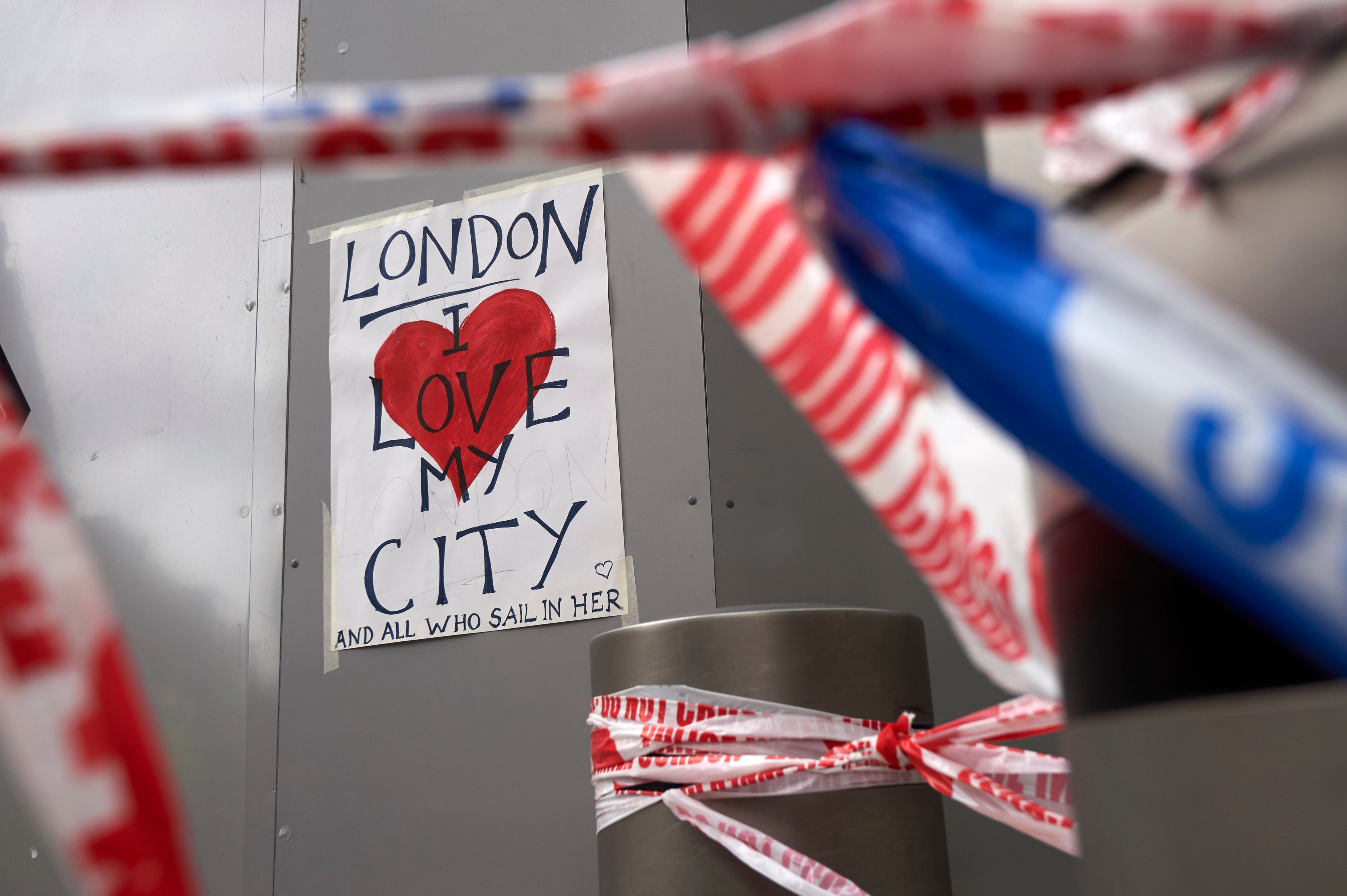 A poster in solidarity is seen on a hoarding outside London Bridge railway station in London on June 5, 2017 at the cordon near the police scene of the June 3 terror attack on London Bridge and the nearby Borough Market.