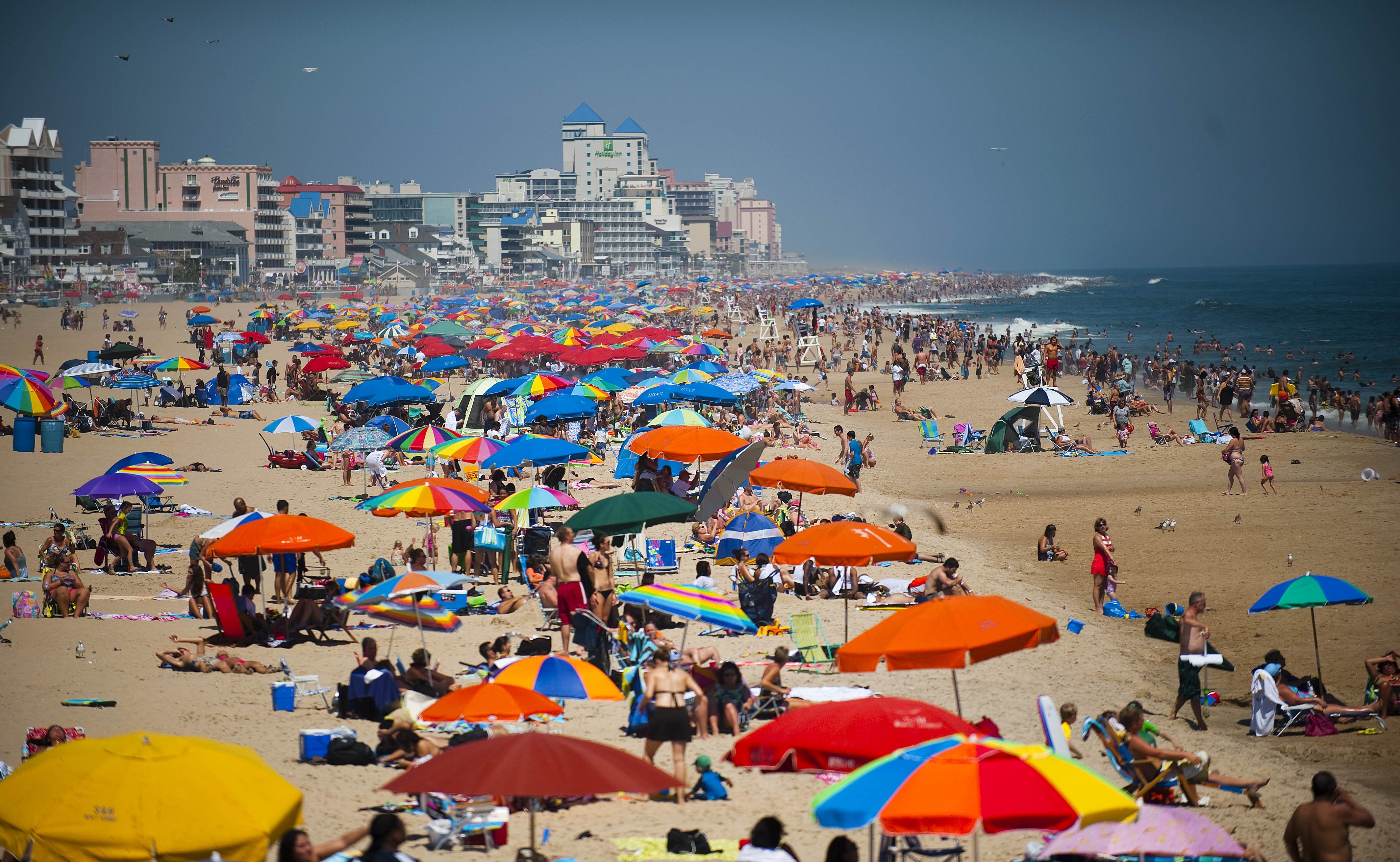 People line the beach in Ocean City, Maryland, on Aug. 29, 2010. (JIM WATSON—AFP/Getty Images)