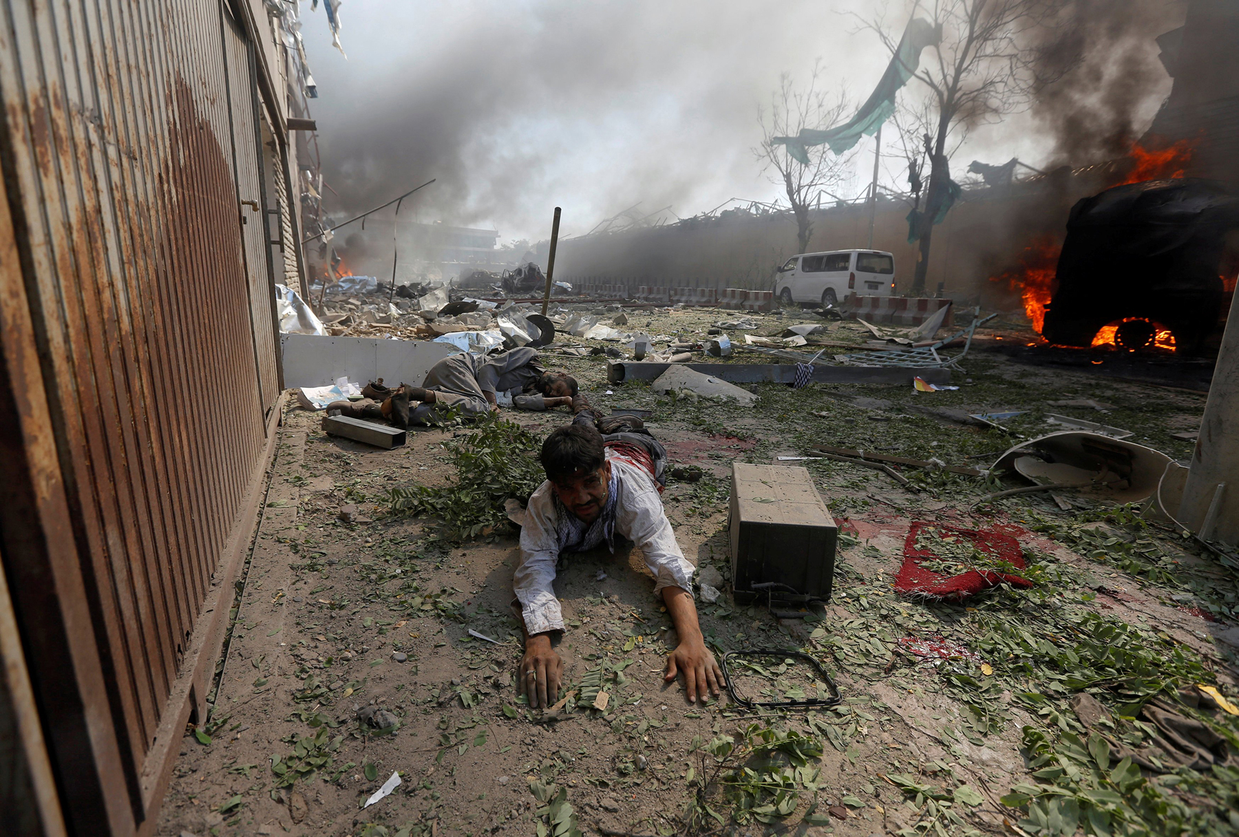 A wounded man lies on the ground after a massive blast in Kabul on May 31, 2017. (Omar Sobhani—Reuters)