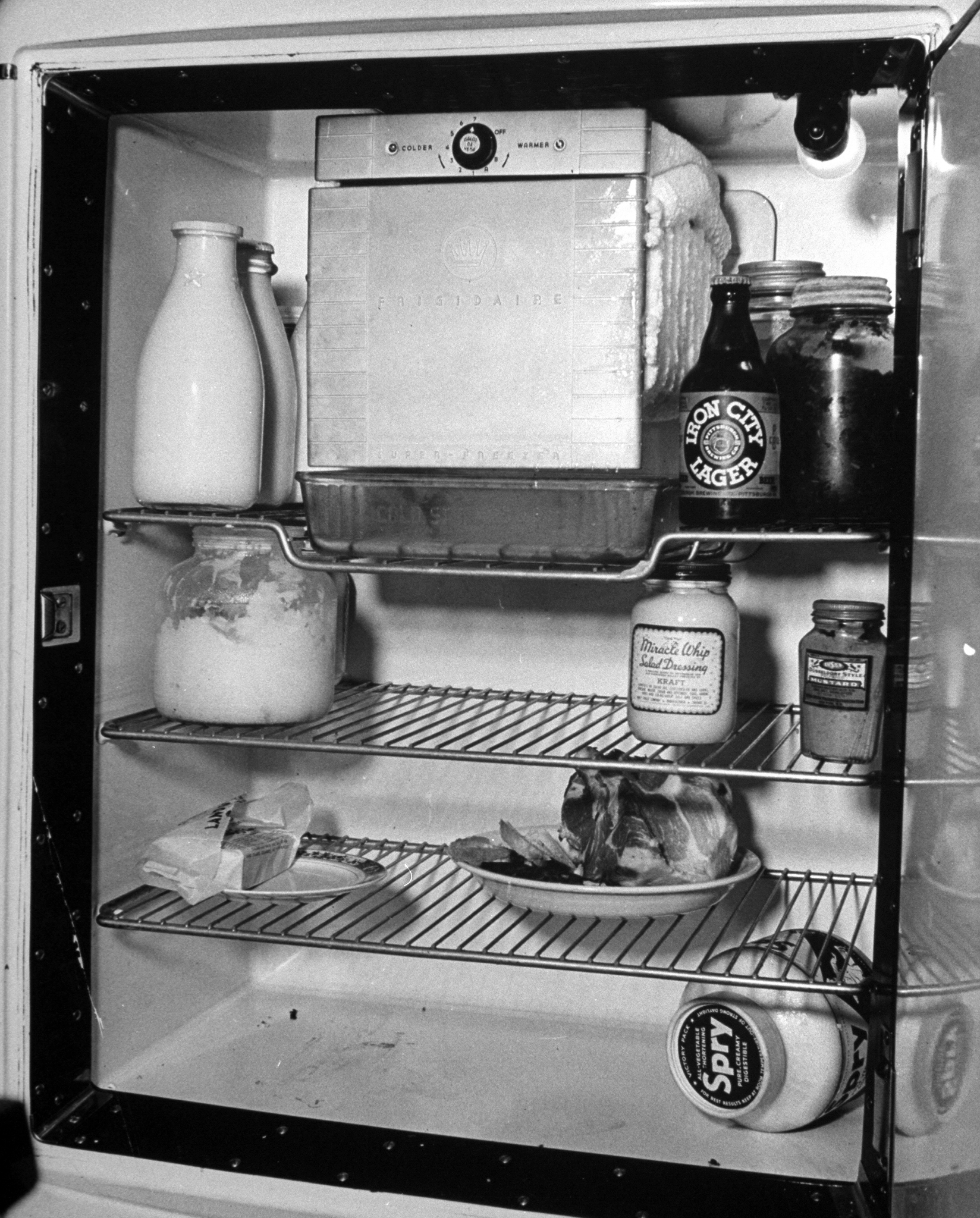 An open refrigerator showing the contents in a steel workers home in Pittsburgh.